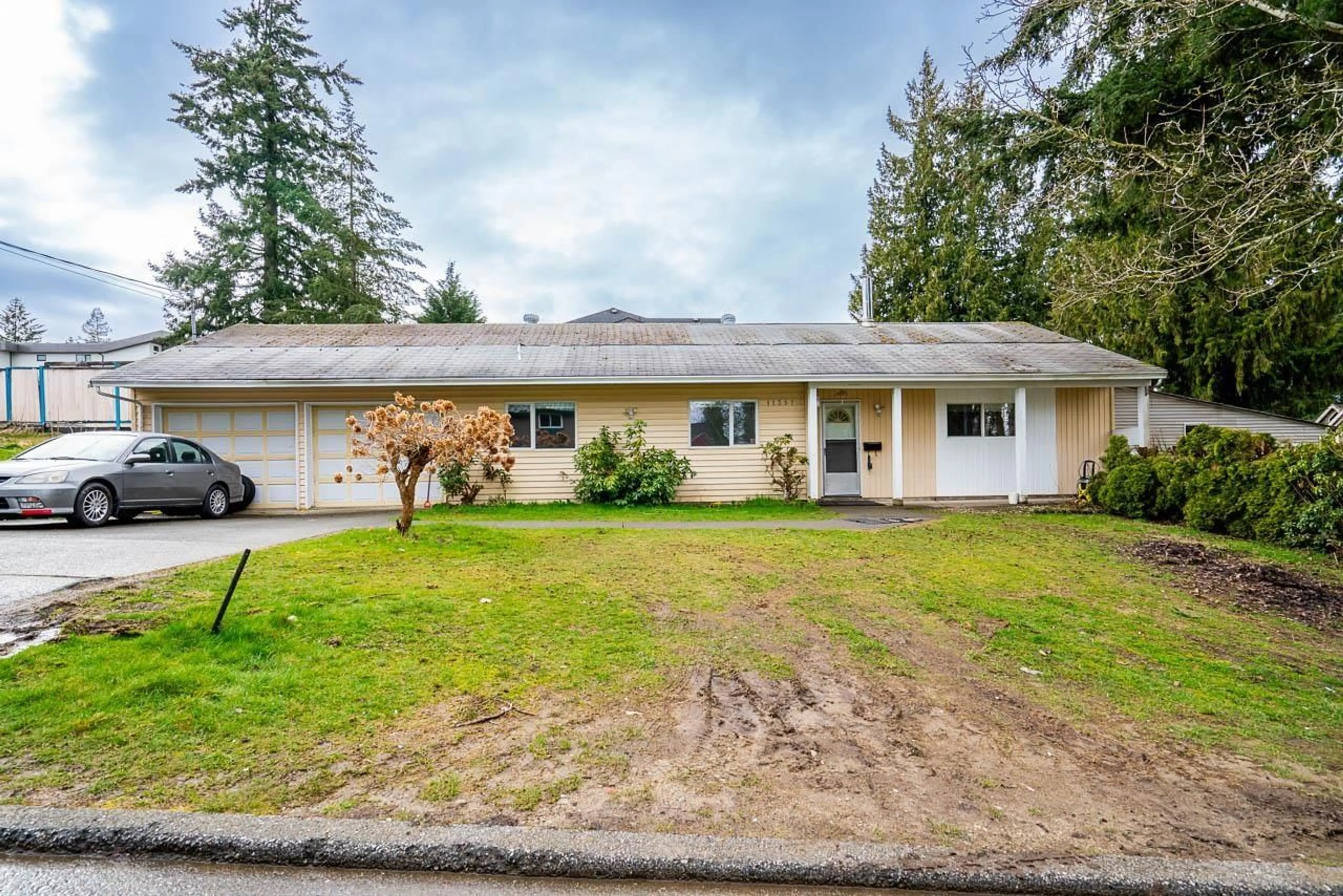 Home with vinyl exterior material, street for 11397 141A STREET, Surrey British Columbia V3R8Z1