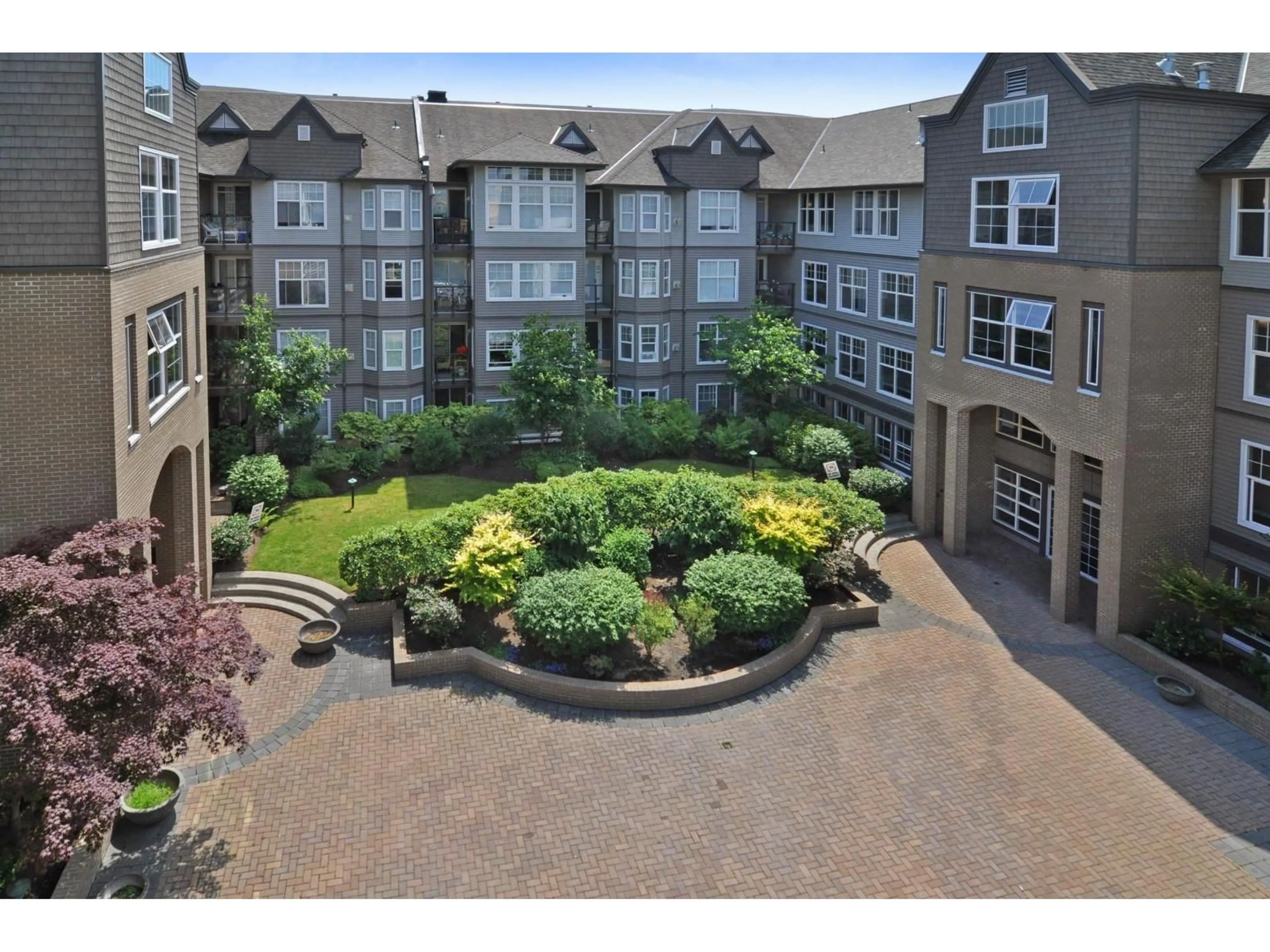 A pic from outside/outdoor area/front of a property/back of a property/a pic from drone, unknown for 204 - 20200 56 AVENUE, Langley British Columbia V3A8S1