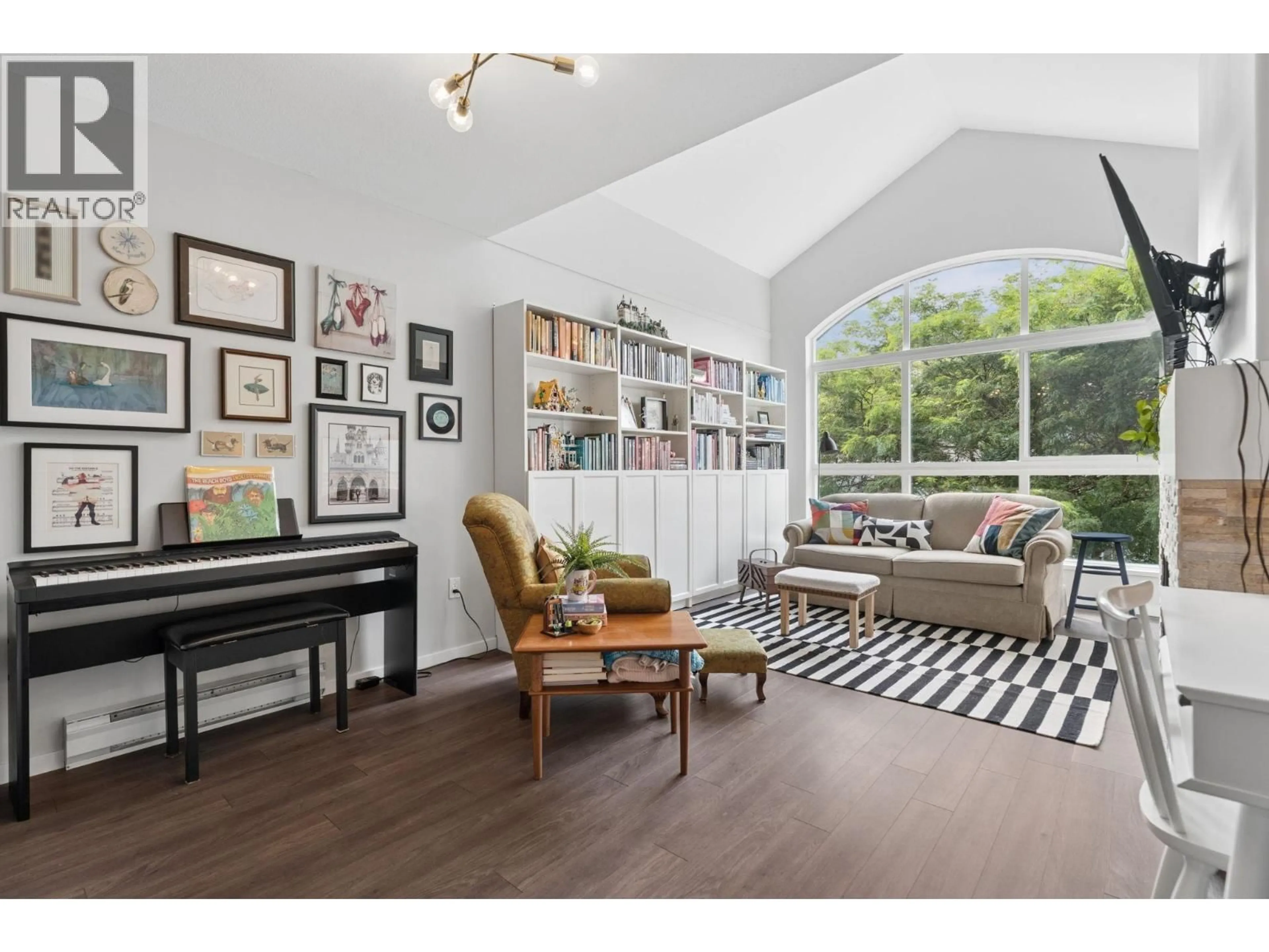 Living room with furniture, wood/laminate floor for 410 - 5500 LYNAS LANE, Richmond British Columbia V7C5R5