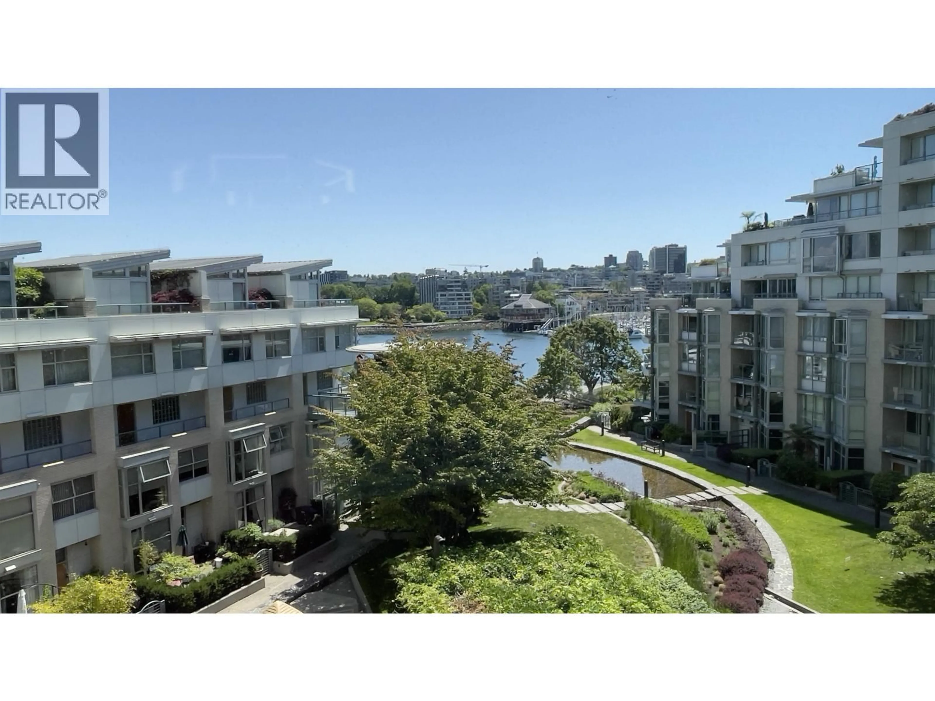A pic from outside/outdoor area/front of a property/back of a property/a pic from drone, water/lake/river/ocean view for 605 - 1228 MARINASIDE CRESCENT, Vancouver British Columbia V6Z2W4