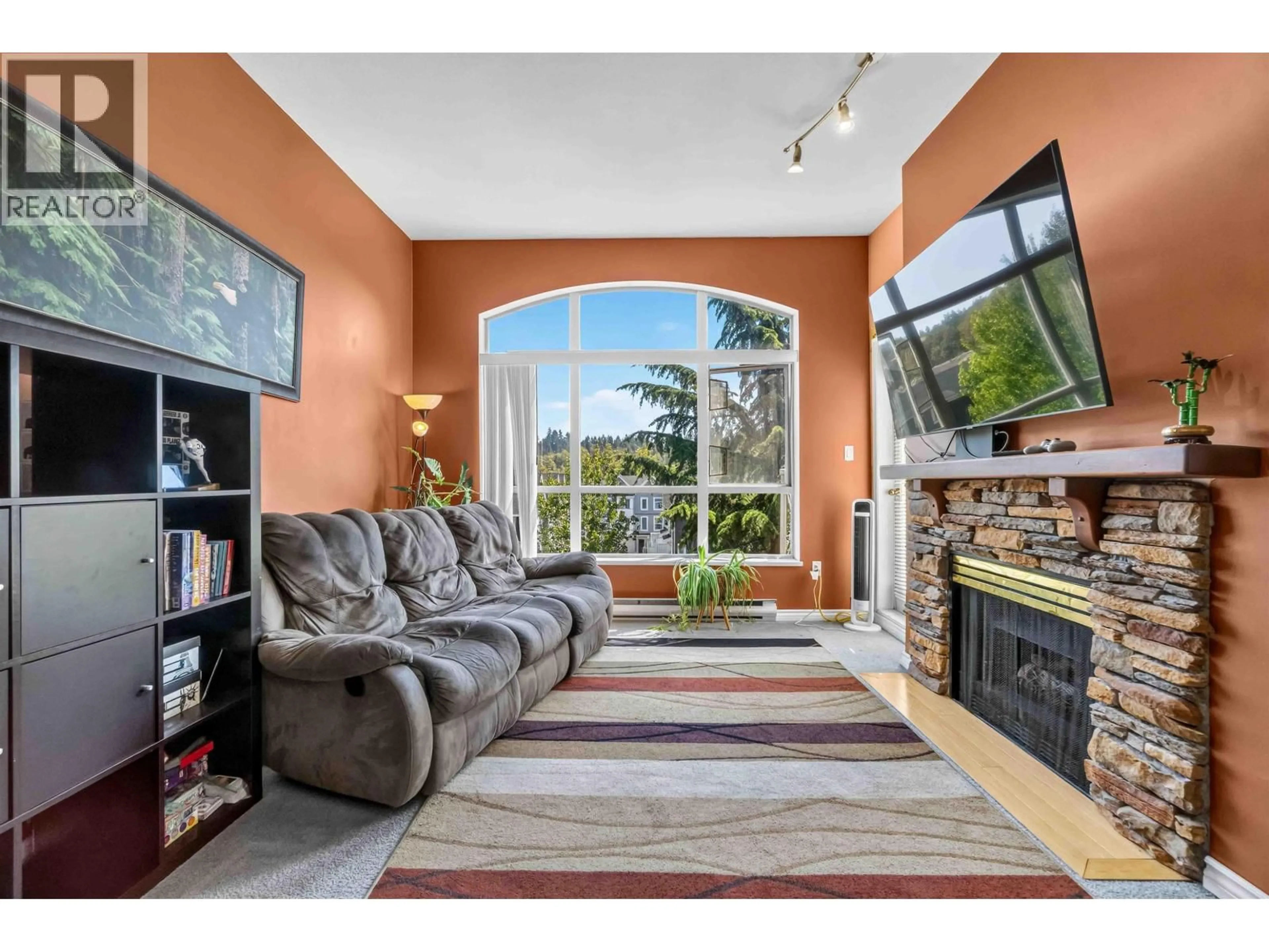 Living room with furniture, ceramic/tile floor for 422 - 2551 PARKVIEW LANE, Port Coquitlam British Columbia V3C6J8