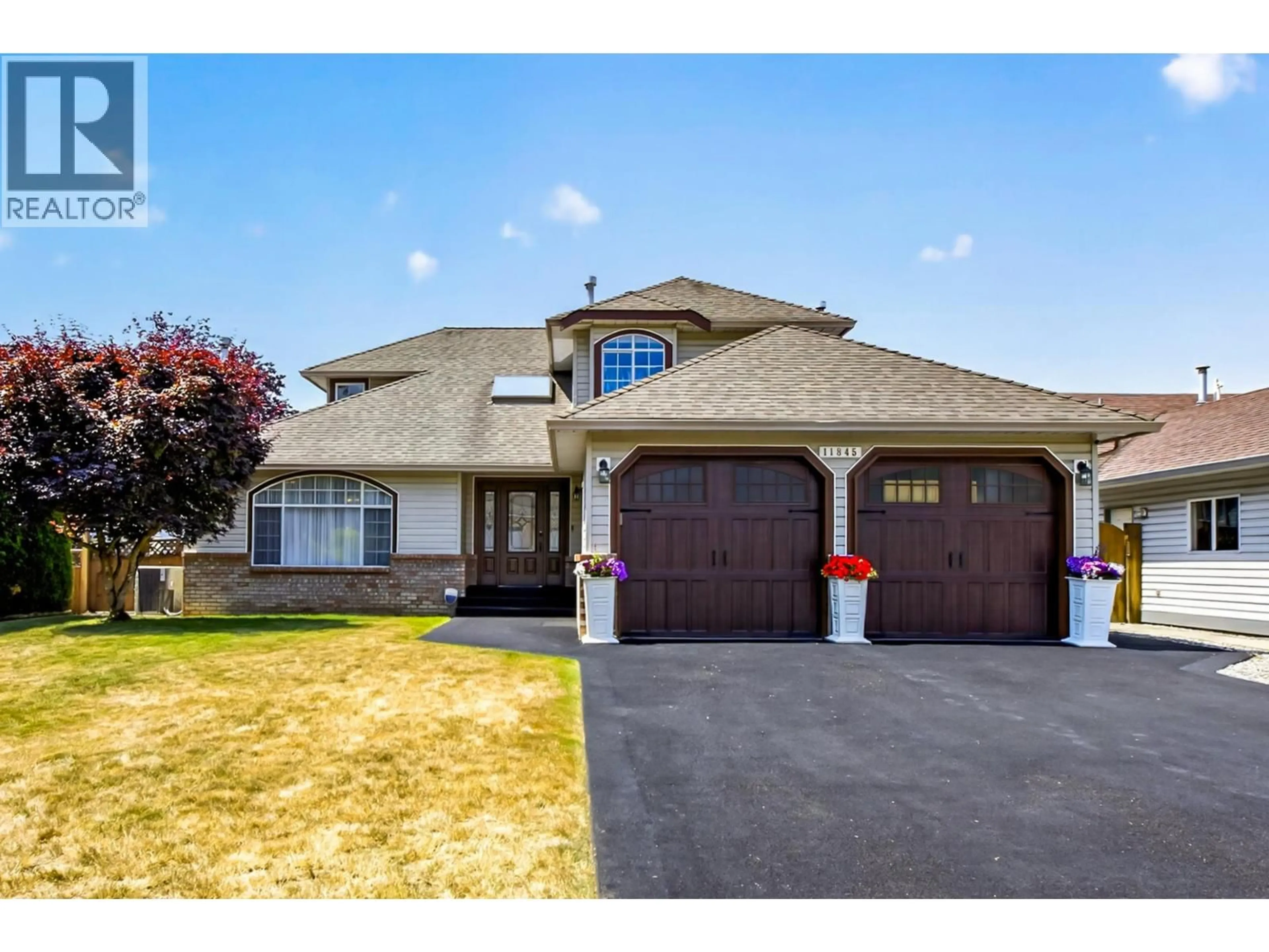 Home with vinyl exterior material, street for 11845 190TH STREET, Pitt Meadows British Columbia V3Y2L2