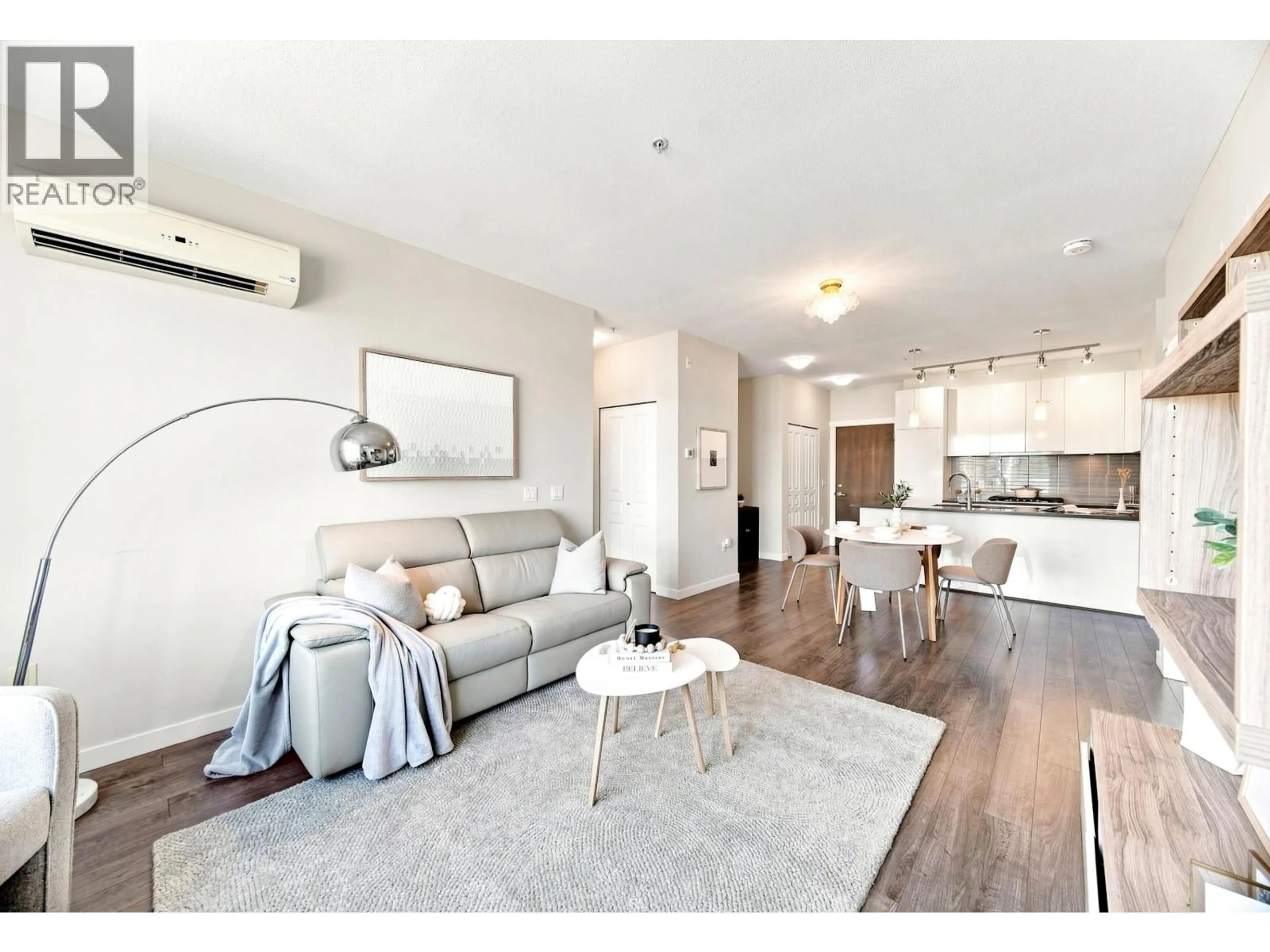Living room with furniture, wood/laminate floor for 410 - 9399 ALEXANDRA ROAD, Richmond British Columbia V6X0L7