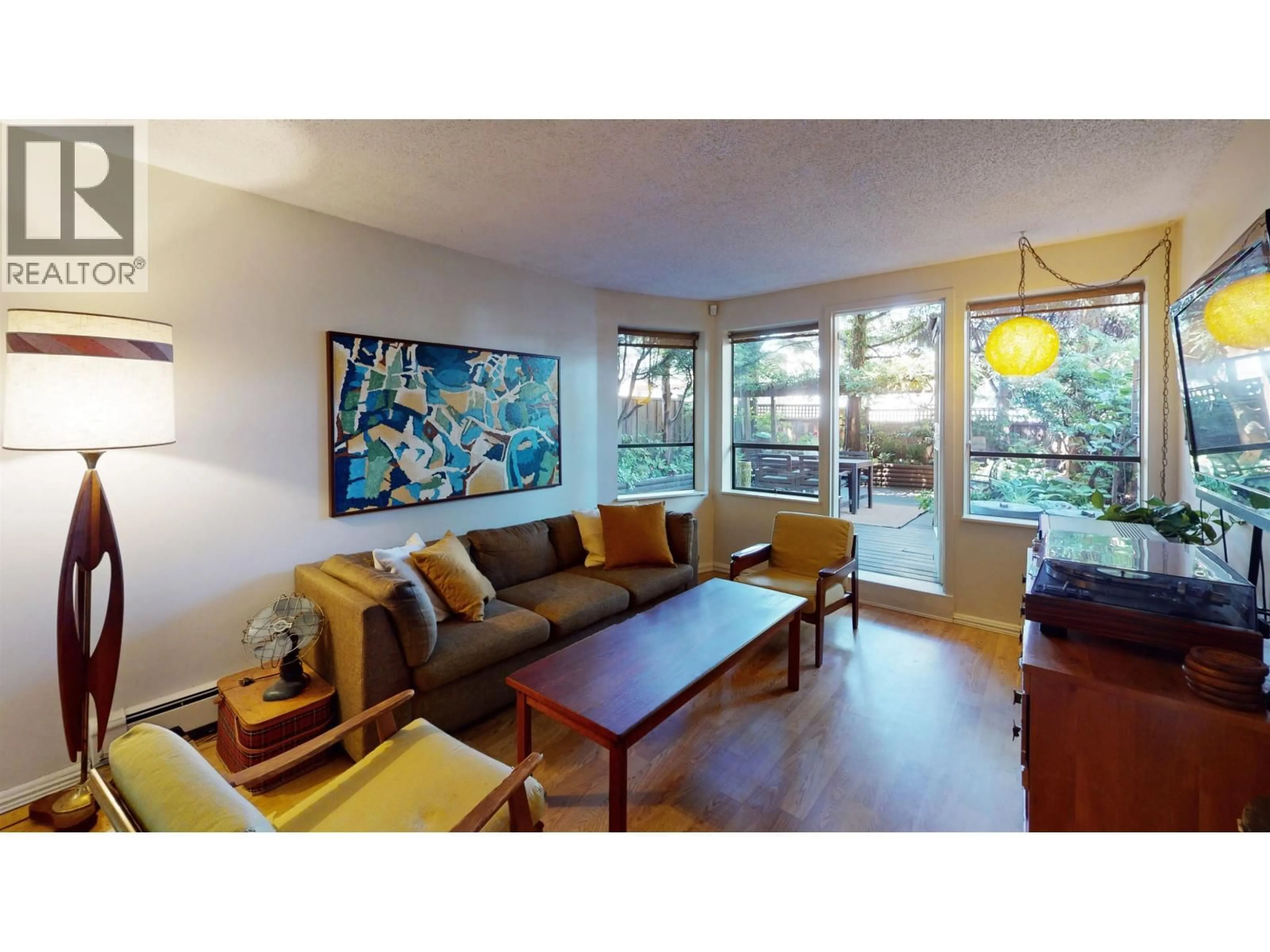 Living room with furniture, wood/laminate floor for 111 - 853 7TH AVENUE, Vancouver British Columbia V5T1P4
