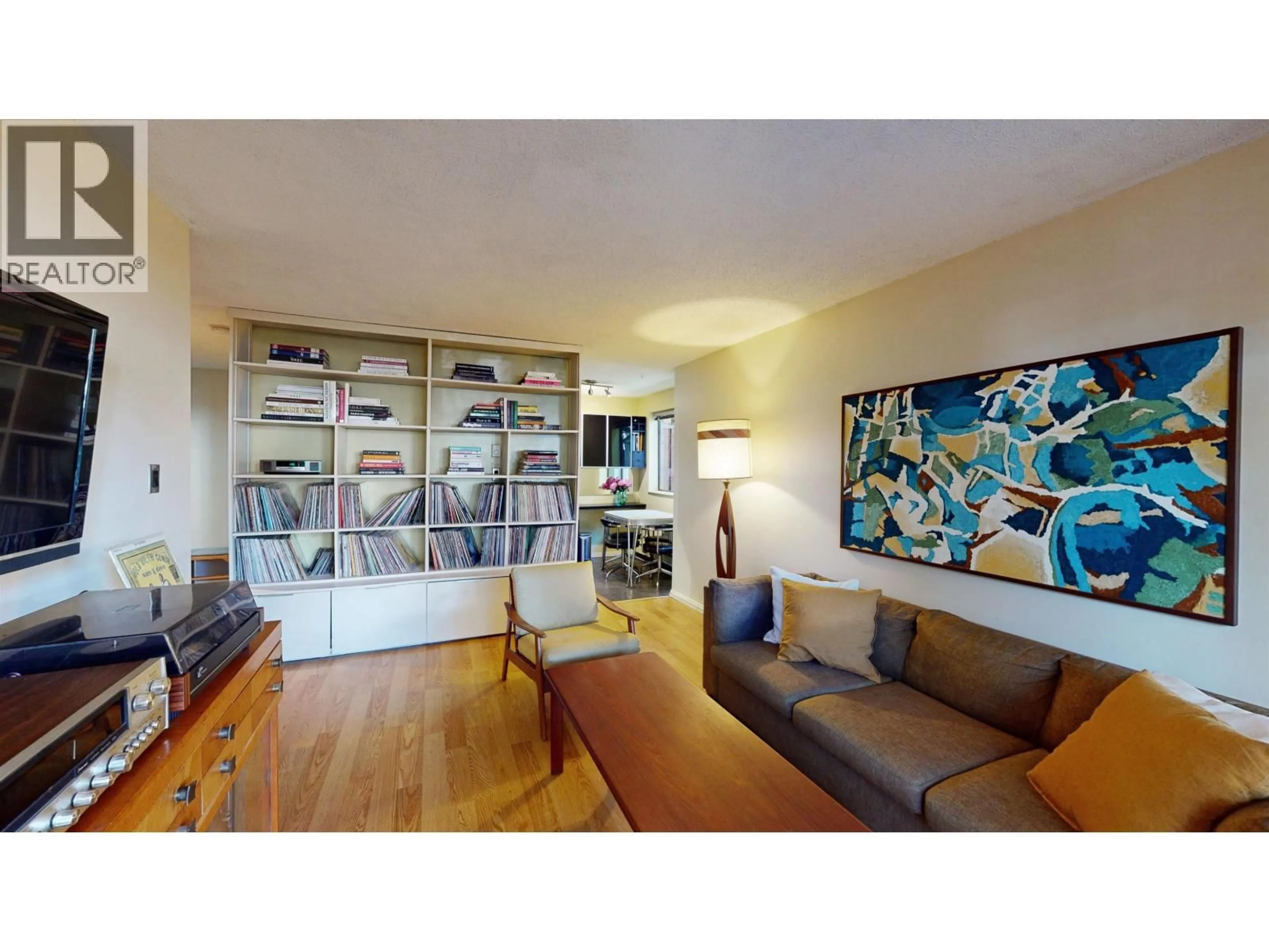 Living room with furniture, wood/laminate floor for 111 - 853 7TH AVENUE, Vancouver British Columbia V5T1P4