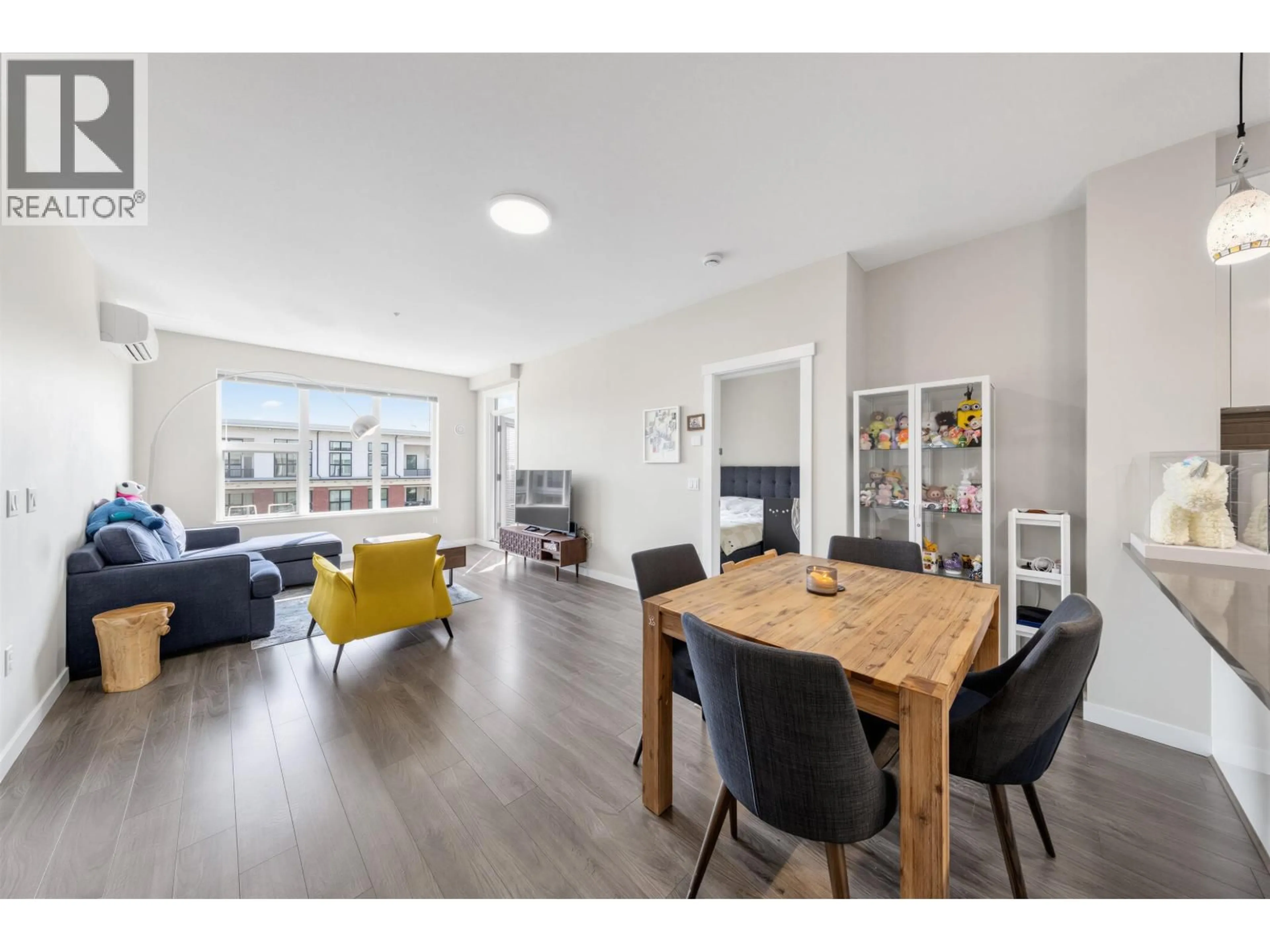 Living room with furniture, wood/laminate floor for 418 - 9388 TOMICKI AVENUE, Richmond British Columbia V6X0P1