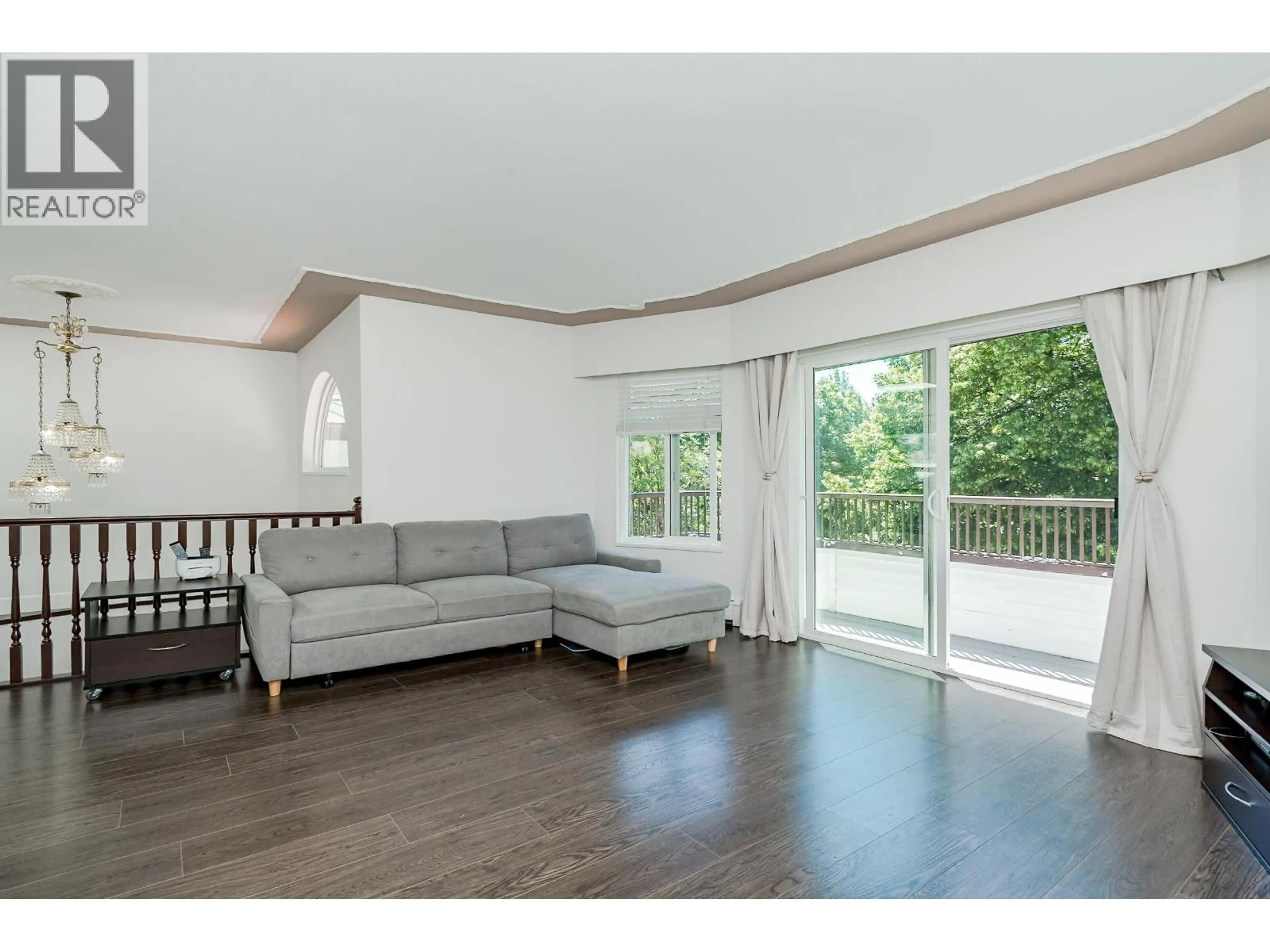 Living room with furniture, wood/laminate floor for 6074 SHERBROOKE STREET, Vancouver British Columbia V5W3N2