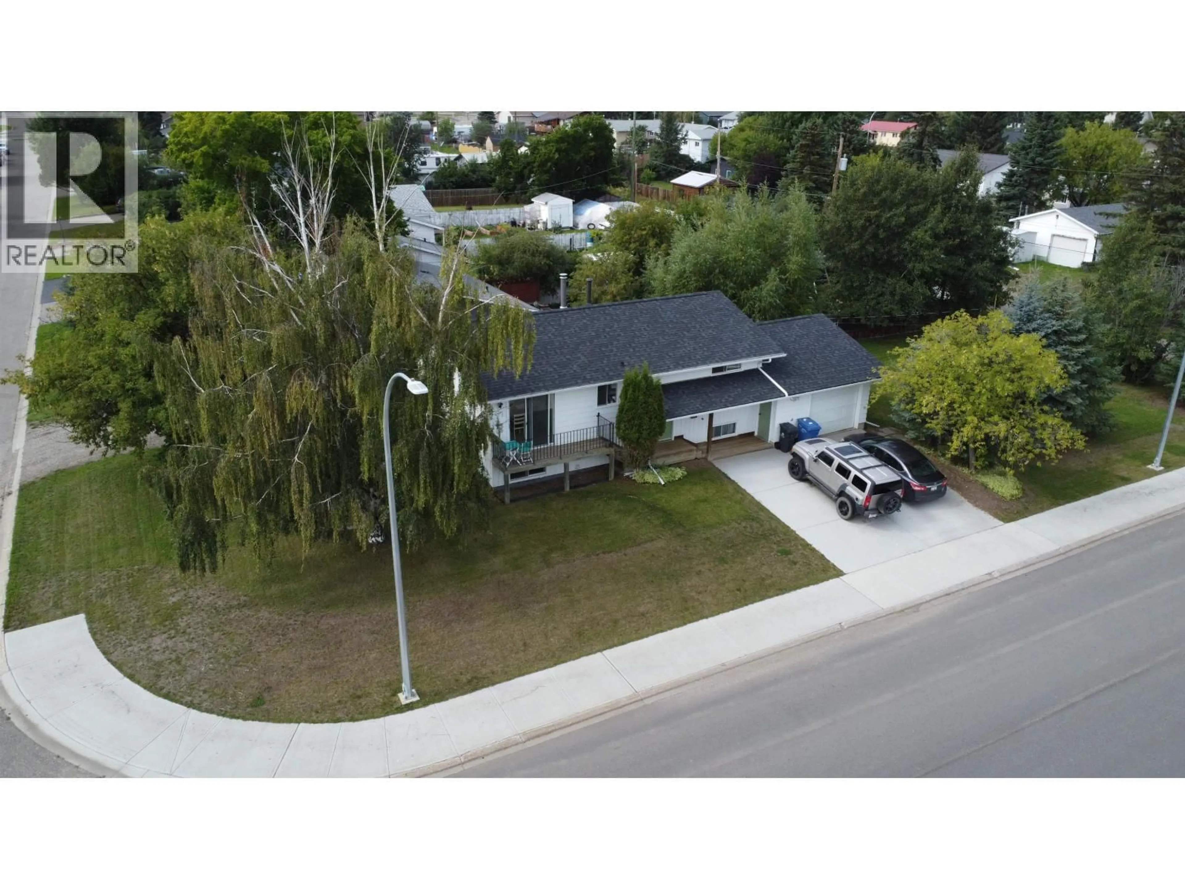 A pic from outside/outdoor area/front of a property/back of a property/a pic from drone, street for 9404 84 STREET, Fort St. John British Columbia V1J3E4