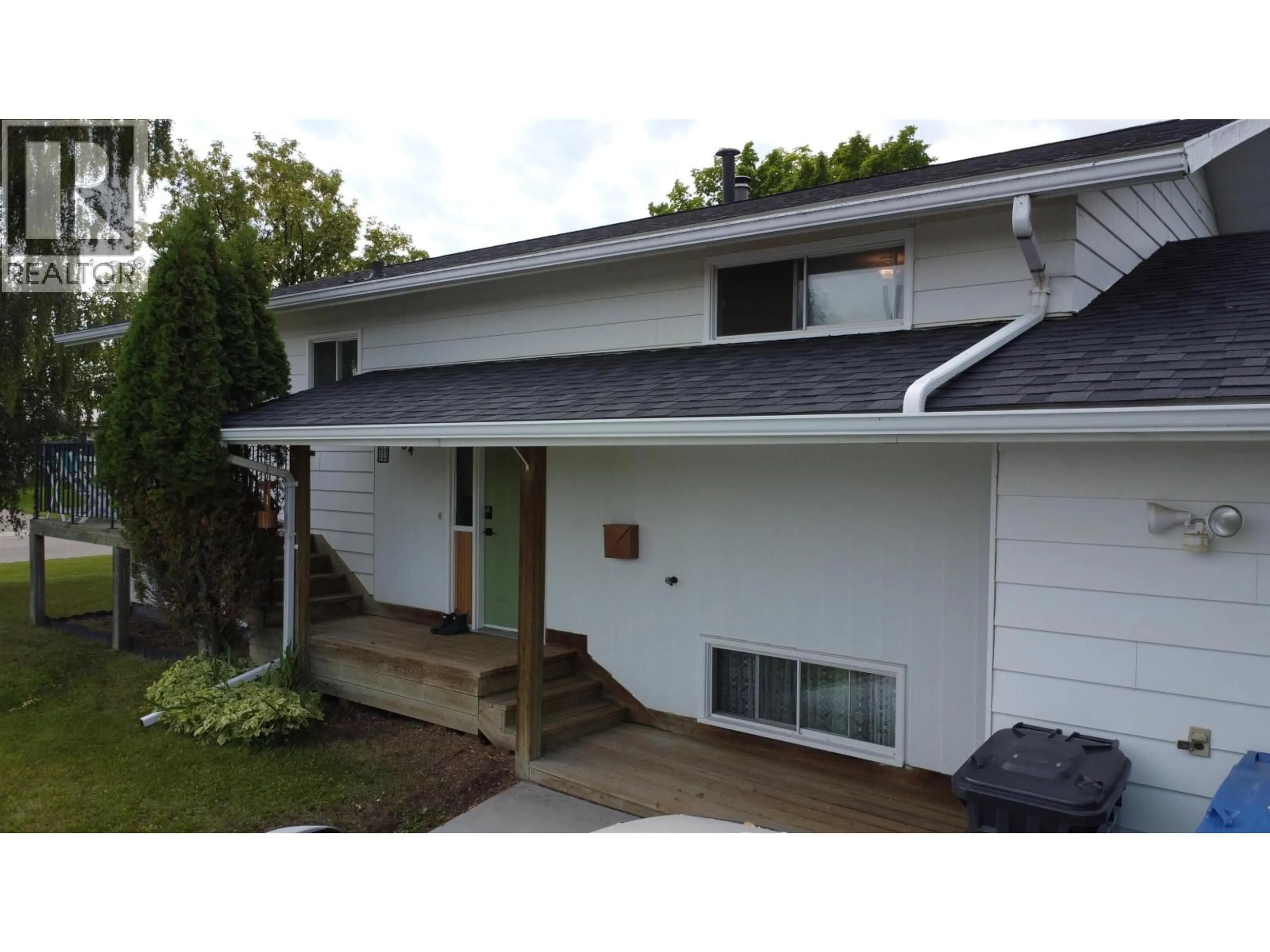 Home with vinyl exterior material, street for 9404 84 STREET, Fort St. John British Columbia V1J3E4