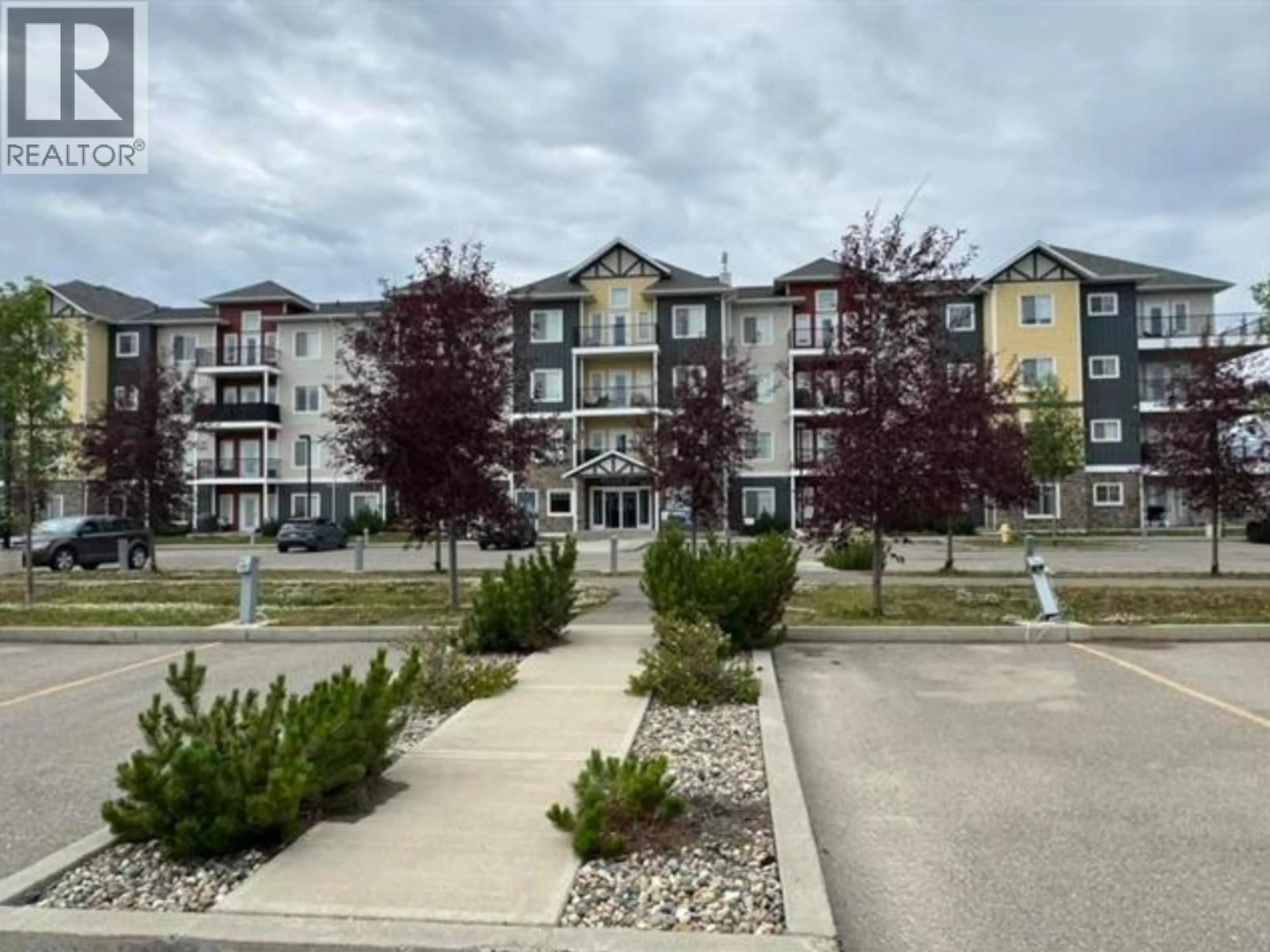 A pic from outside/outdoor area/front of a property/back of a property/a pic from drone, unknown for 106 - 11205 105 AVENUE, Fort St. John British Columbia V1J0L3