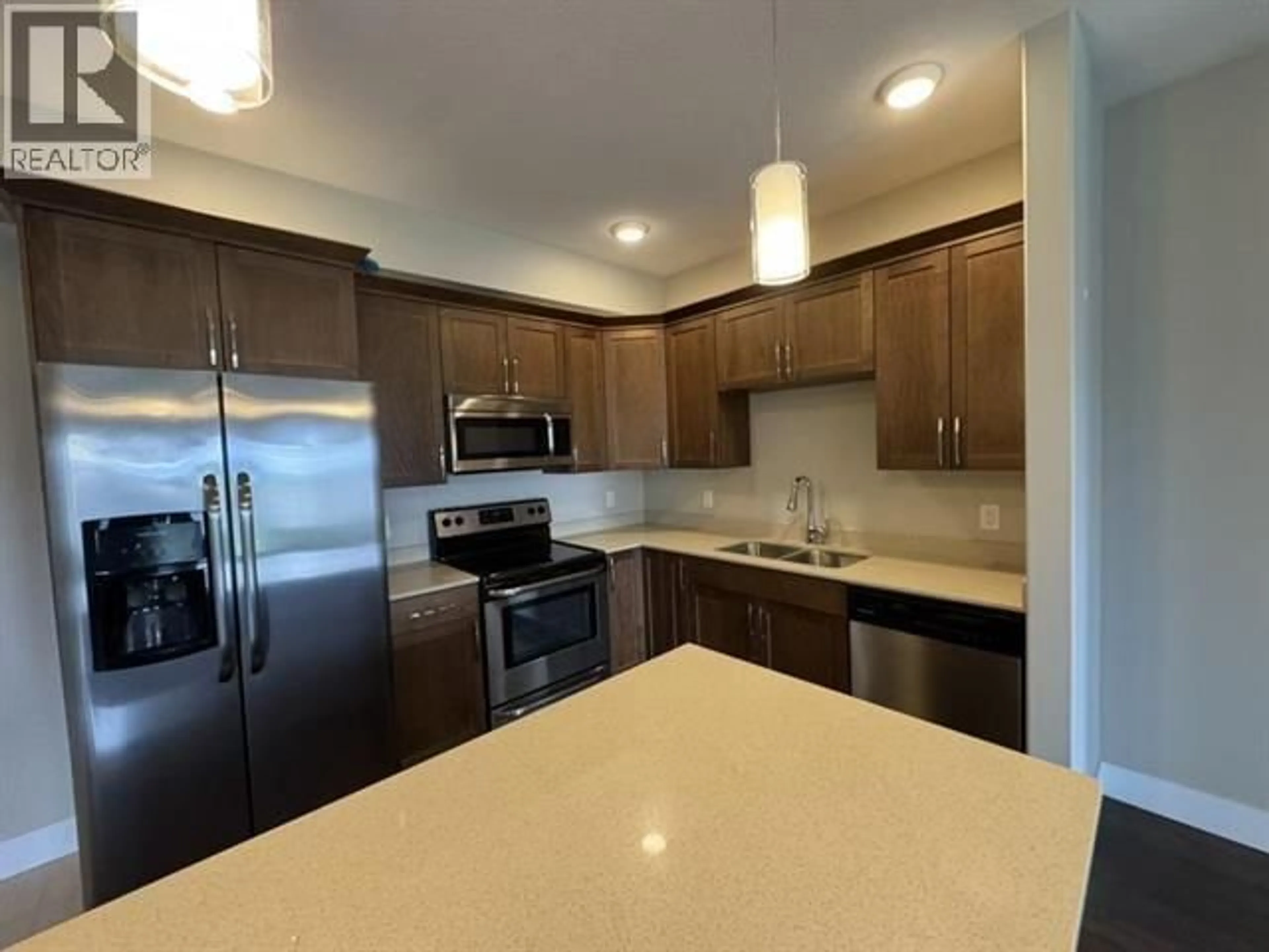 Open concept kitchen, unknown for 106 - 11205 105 AVENUE, Fort St. John British Columbia V1J0L3