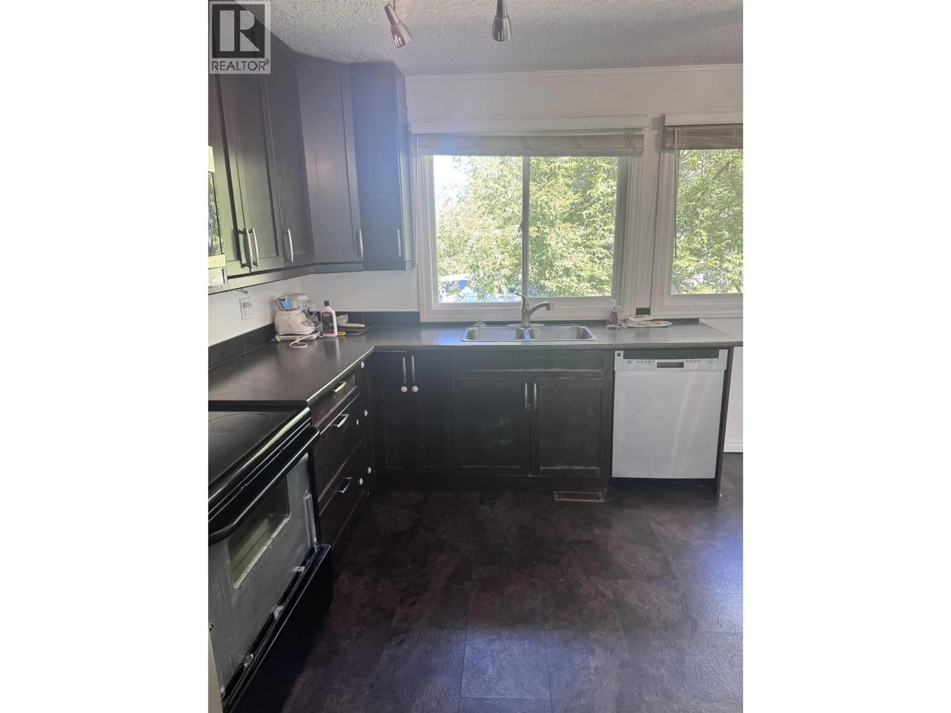 Standard kitchen, wood/laminate floor for 8139 99 AVENUE, Fort St. John British Columbia V1J1S6