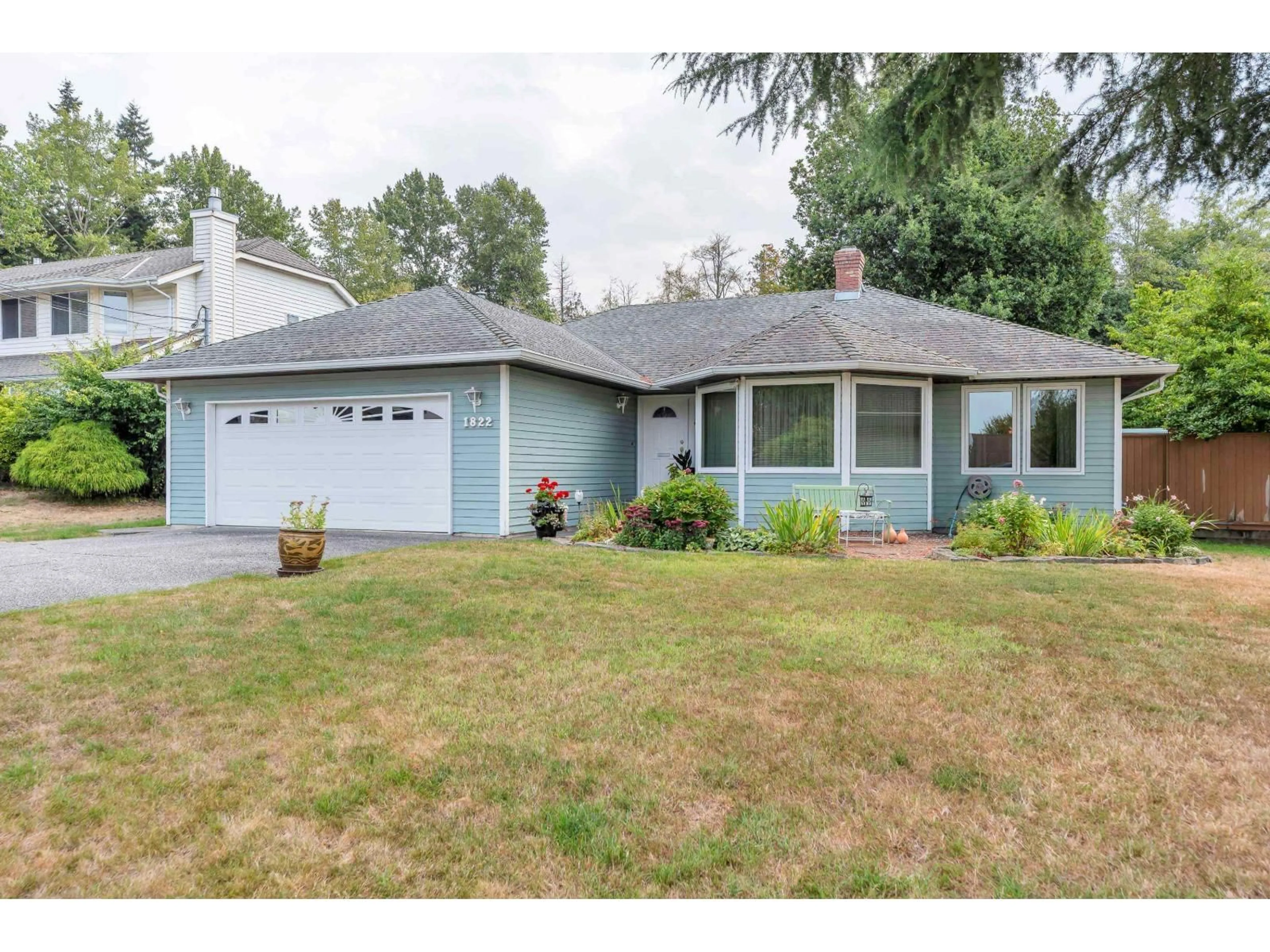 Home with vinyl exterior material, street for 1822 146 STREET, Surrey British Columbia V4A7X6