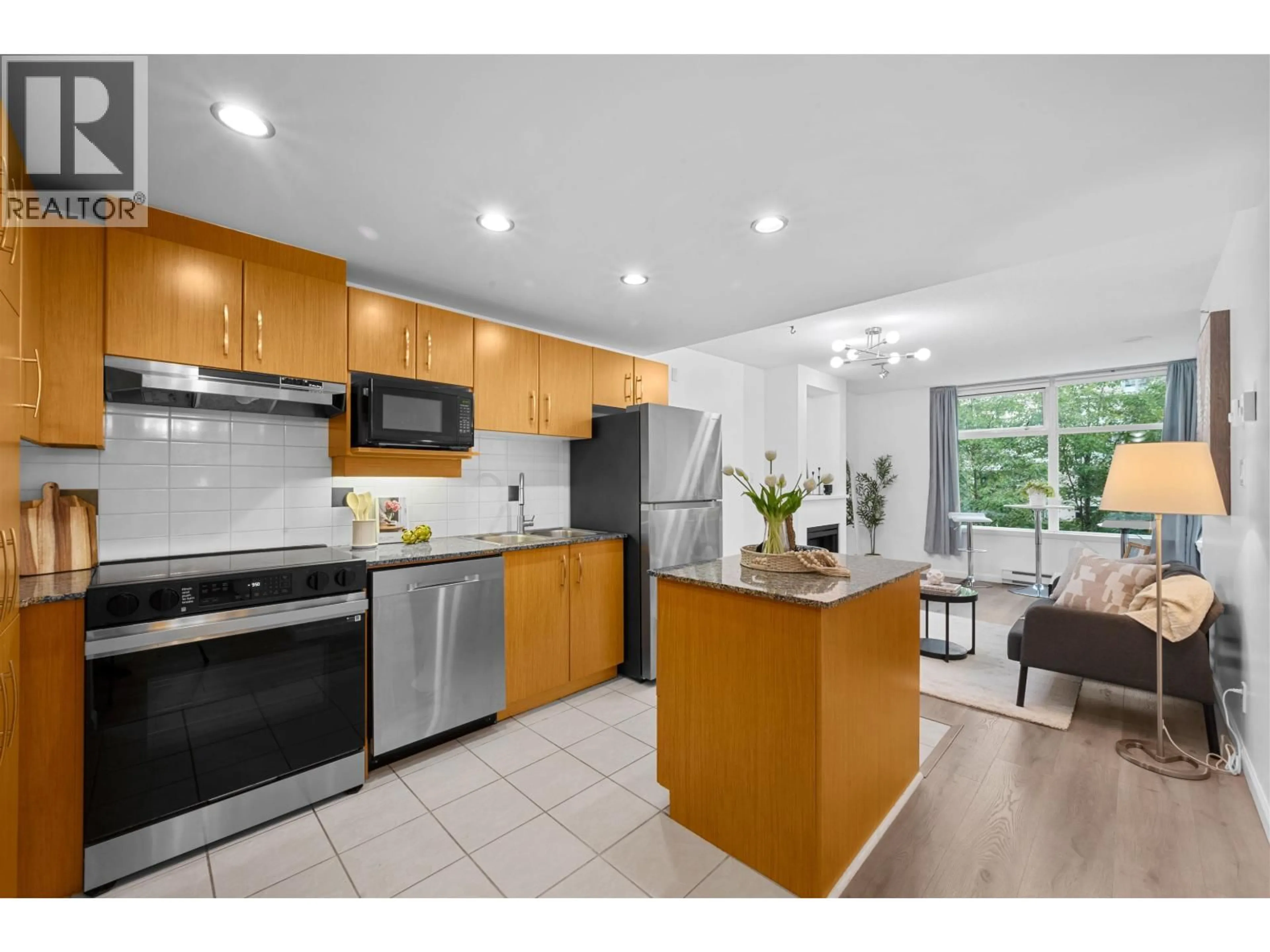 Open concept kitchen, ceramic/tile floor for 303 - 9288 UNIVERSITY CRESCENT, Burnaby British Columbia V5A4X7