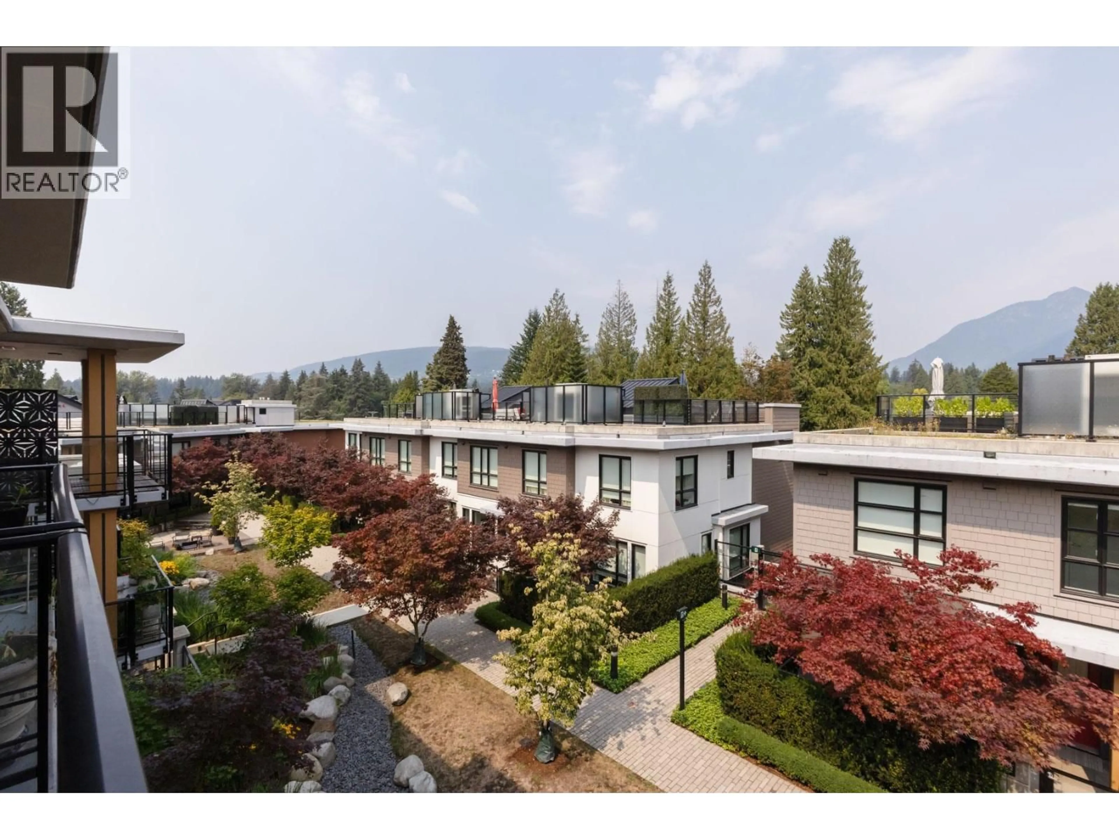 A pic from outside/outdoor area/front of a property/back of a property/a pic from drone, mountain view for 402 - 3220 CONNAUGHT CRESCENT, North Vancouver British Columbia V7R0A5