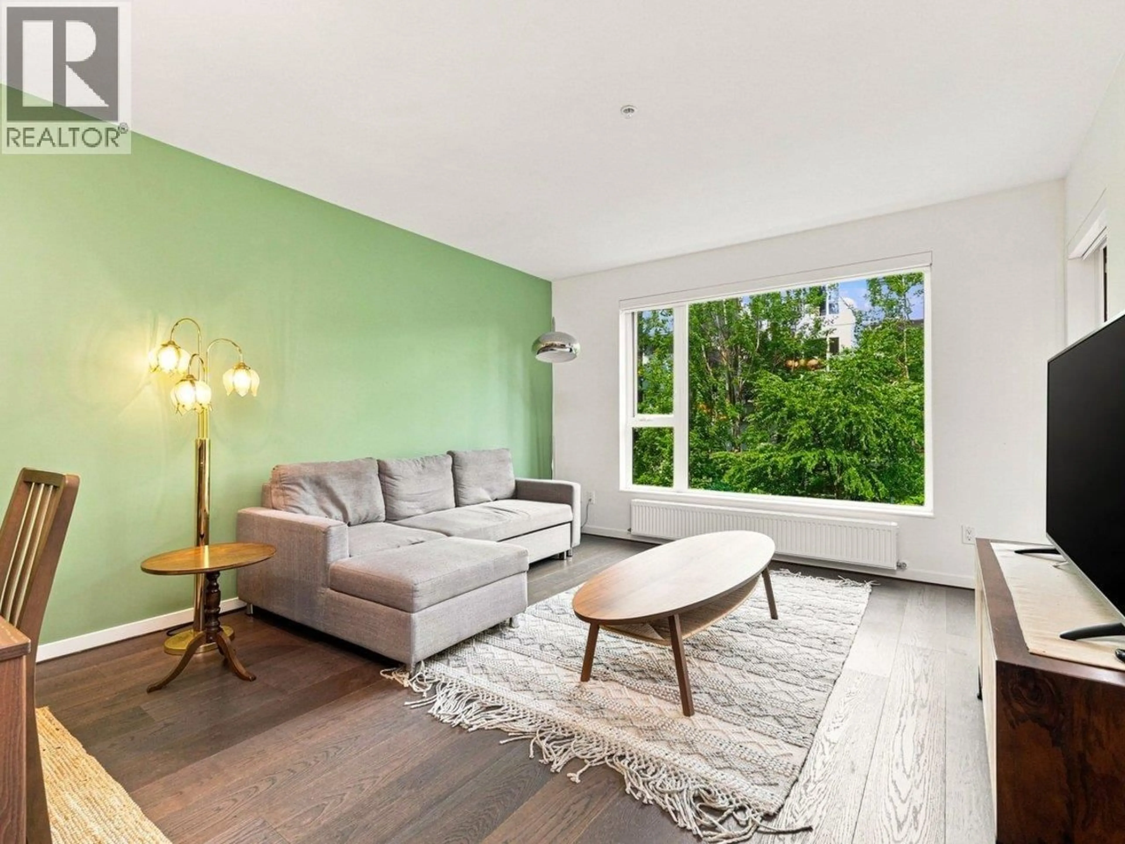 Living room with furniture, wood/laminate floor for 512 - 5955 BIRNEY AVENUE, Vancouver British Columbia V6S0C5