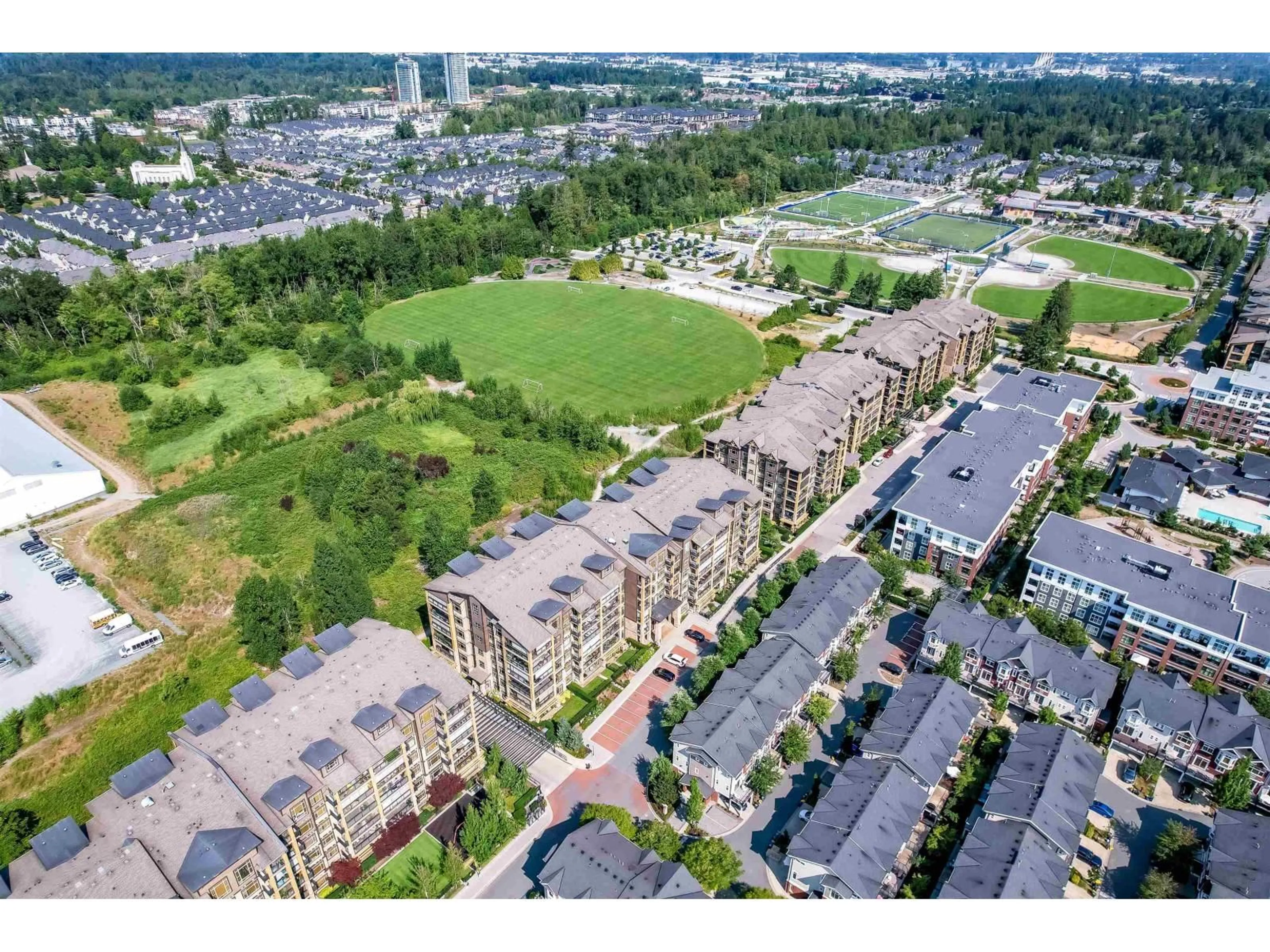 A pic from outside/outdoor area/front of a property/back of a property/a pic from drone, unknown for 301 - 8067 207 STREET, Langley British Columbia V2Y0N9
