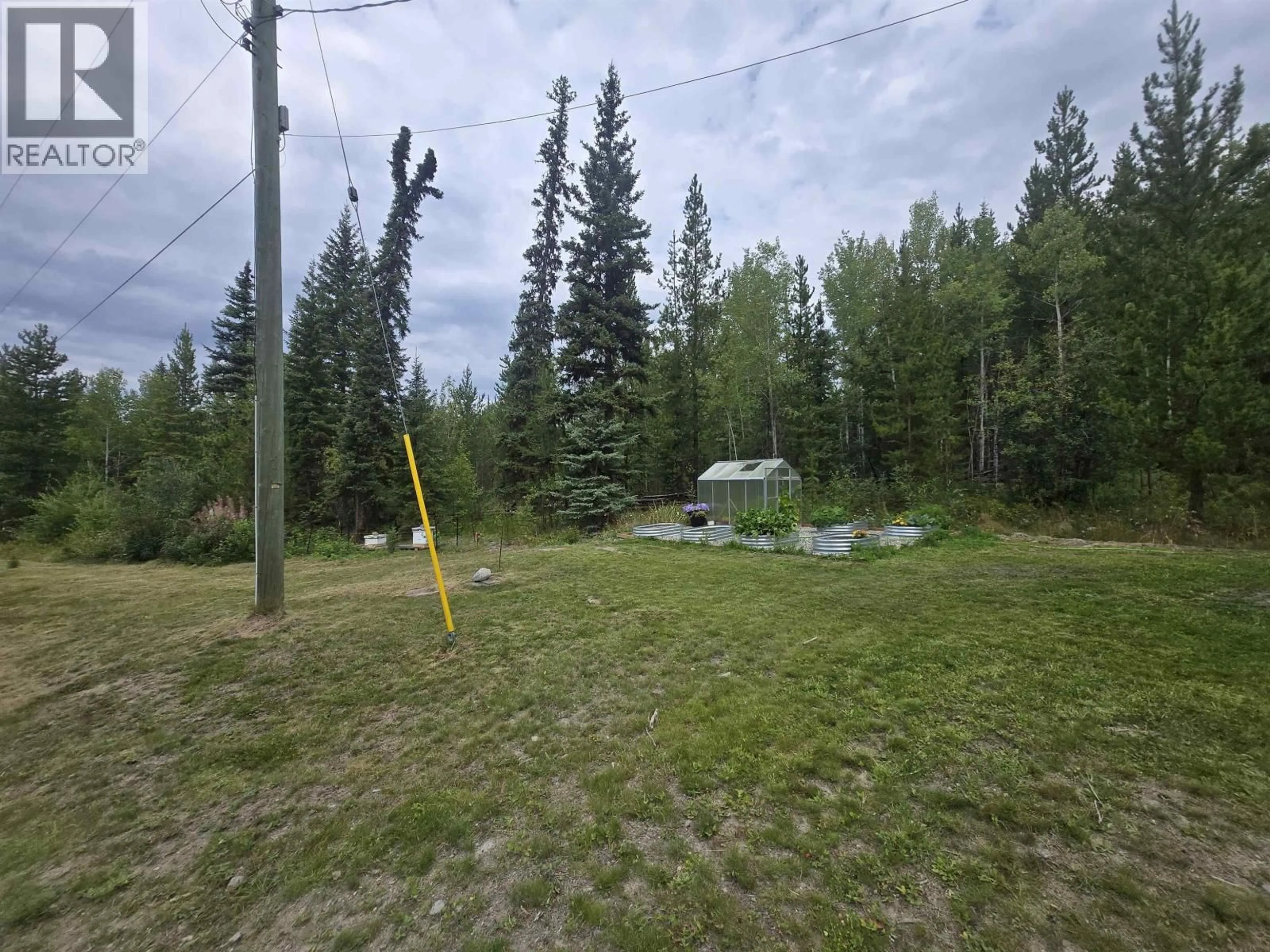 A pic from outside/outdoor area/front of a property/back of a property/a pic from drone, forest/trees view for 1020 RAINBOW ROAD, Quesnel British Columbia V2J3H9