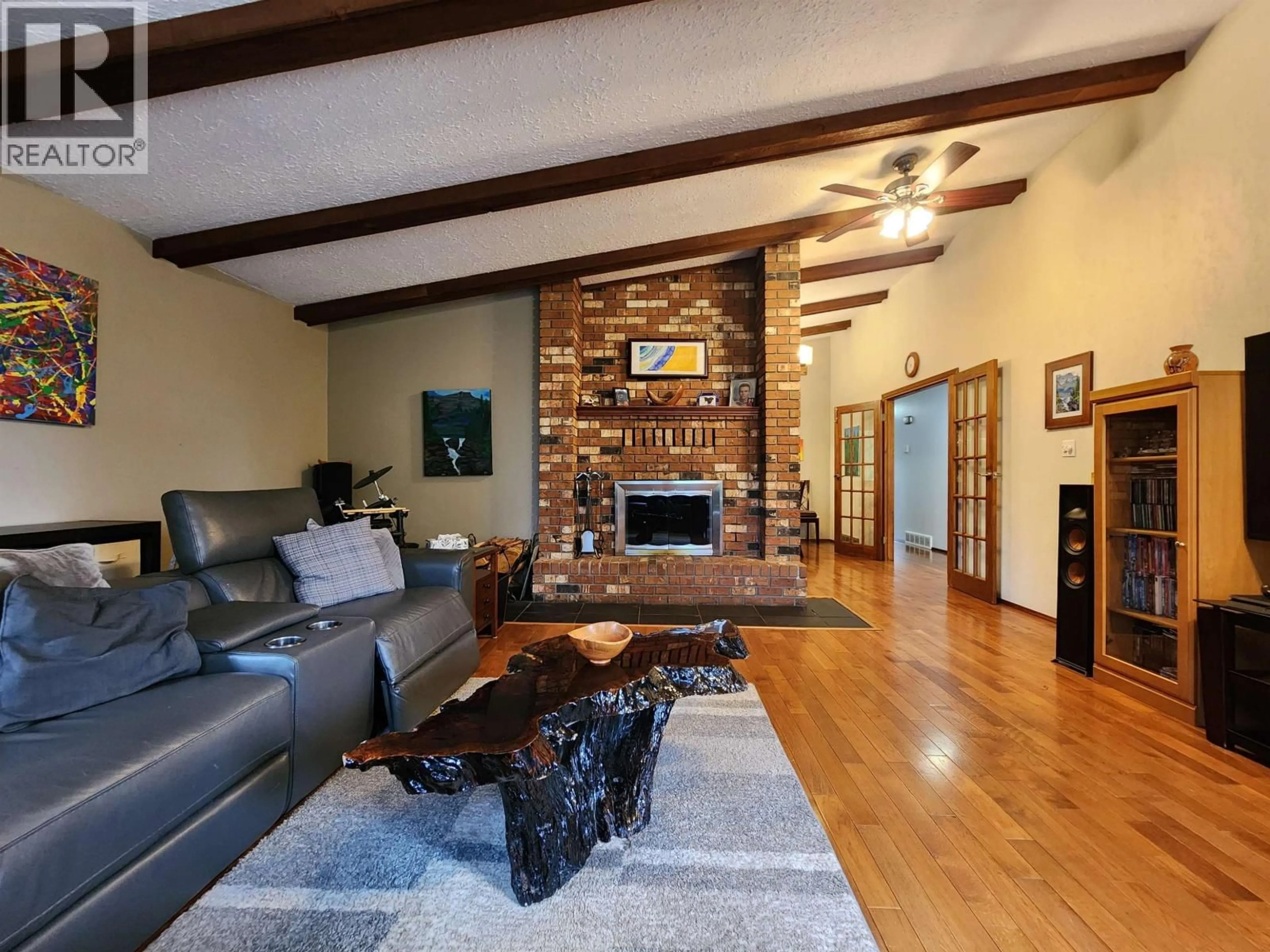 Living room with furniture, wood/laminate floor for 3696 ROSIA ROAD, Prince George British Columbia V2K4Y6