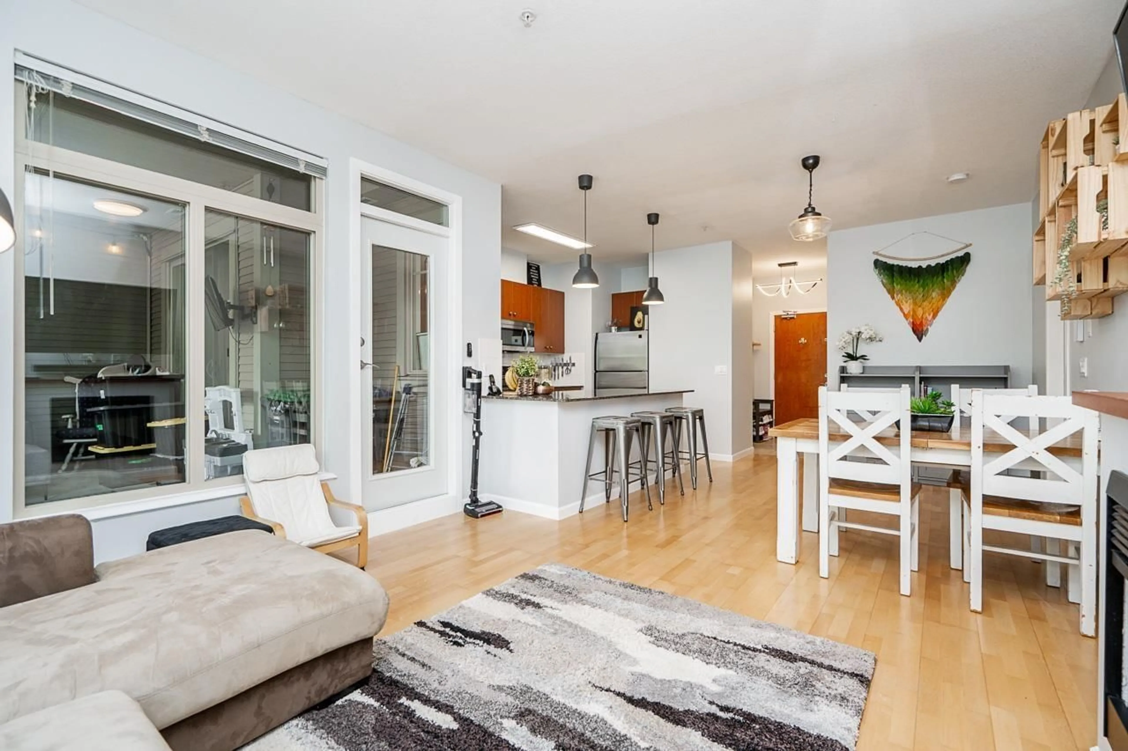 Open concept kitchen, wood/laminate floor for 232 - 10180 153 STREET, Surrey British Columbia V3R0B5