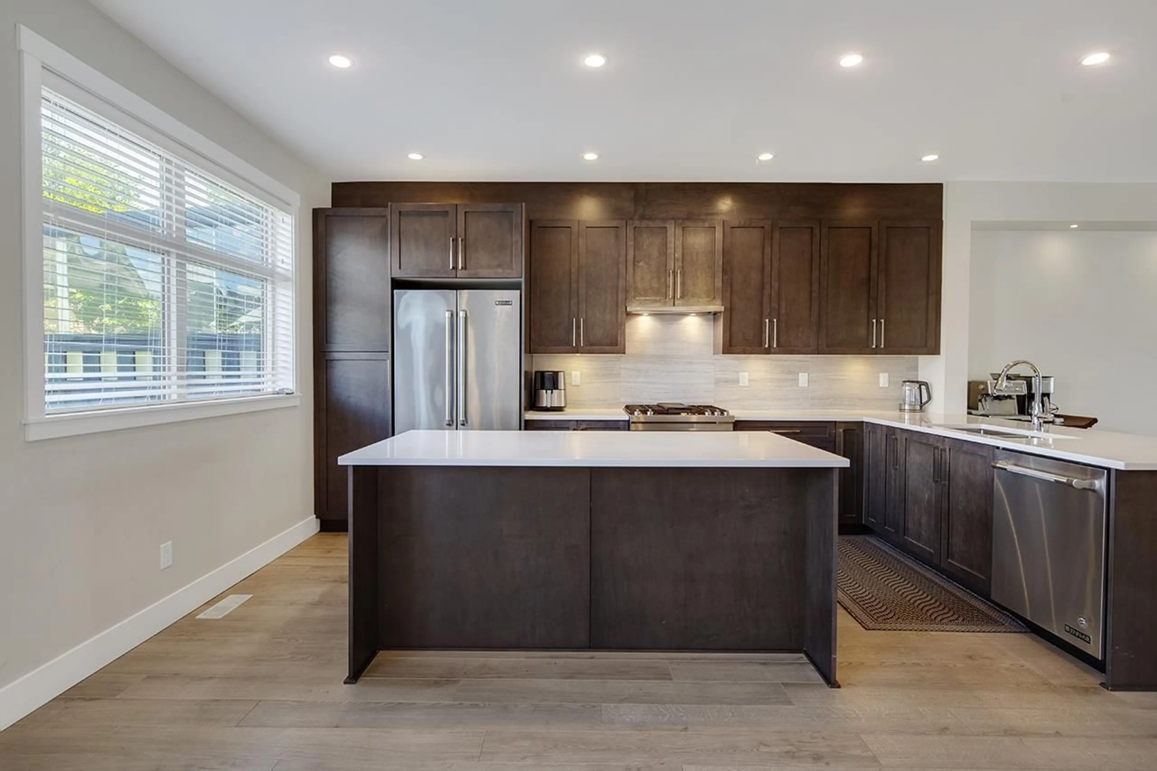 Open concept kitchen, wood/laminate floor for 16439 24 AVENUE, Surrey British Columbia V3Z0V8
