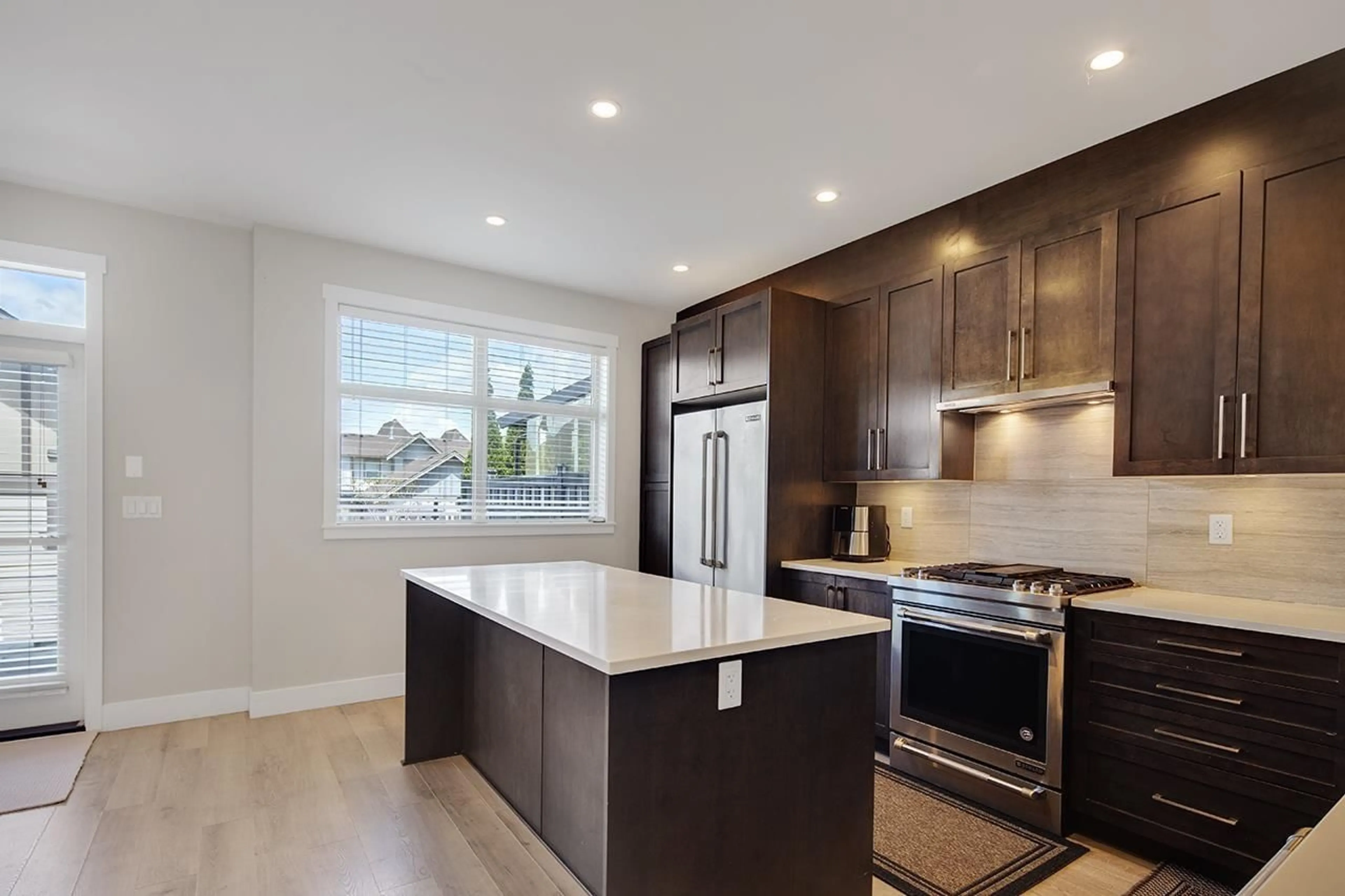 Open concept kitchen, wood/laminate floor for 16439 24 AVENUE, Surrey British Columbia V3Z0V8