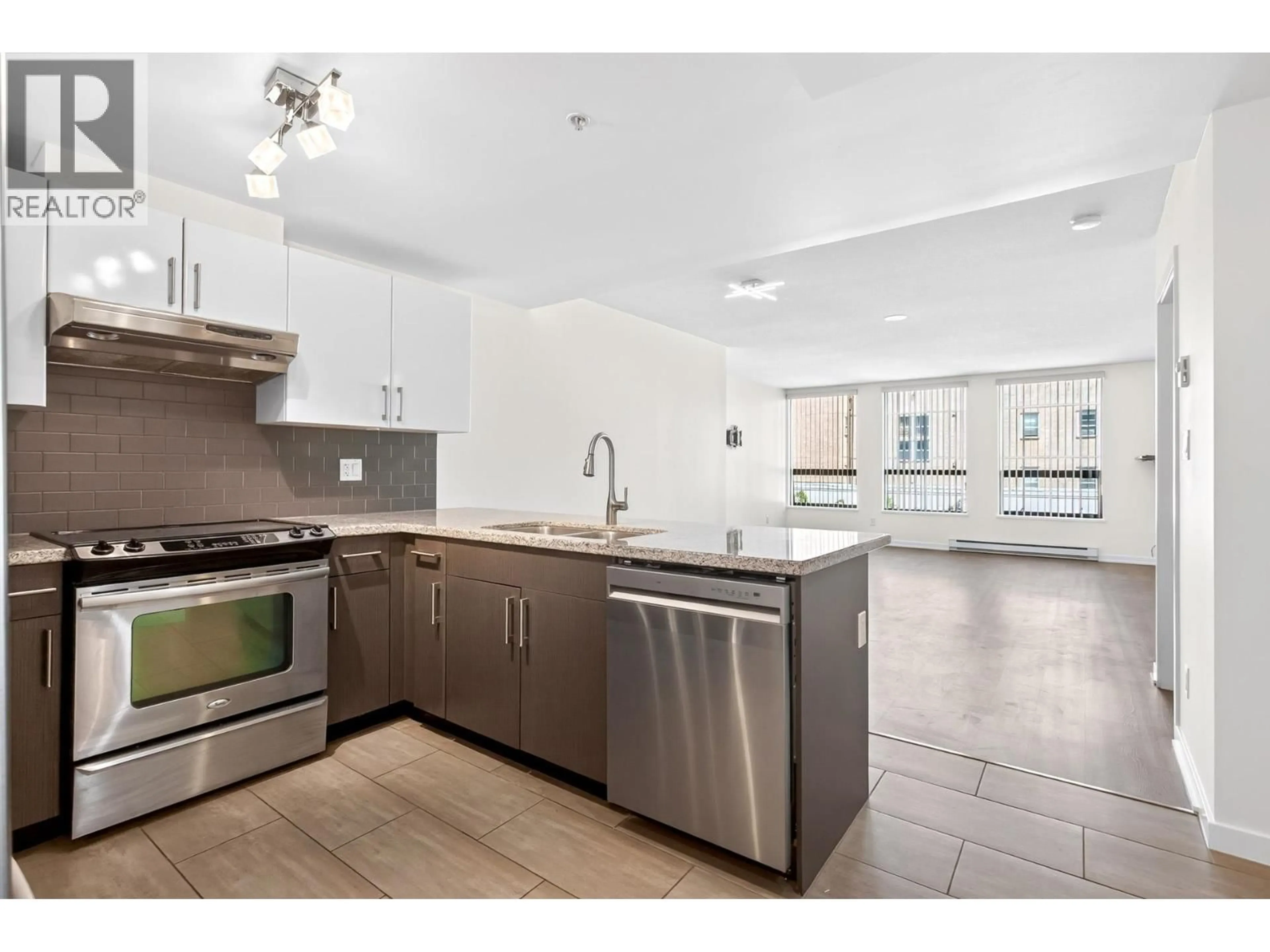 Open concept kitchen, ceramic/tile floor for 406 - 14 BEGBIE STREET, New Westminster British Columbia V3M0C4
