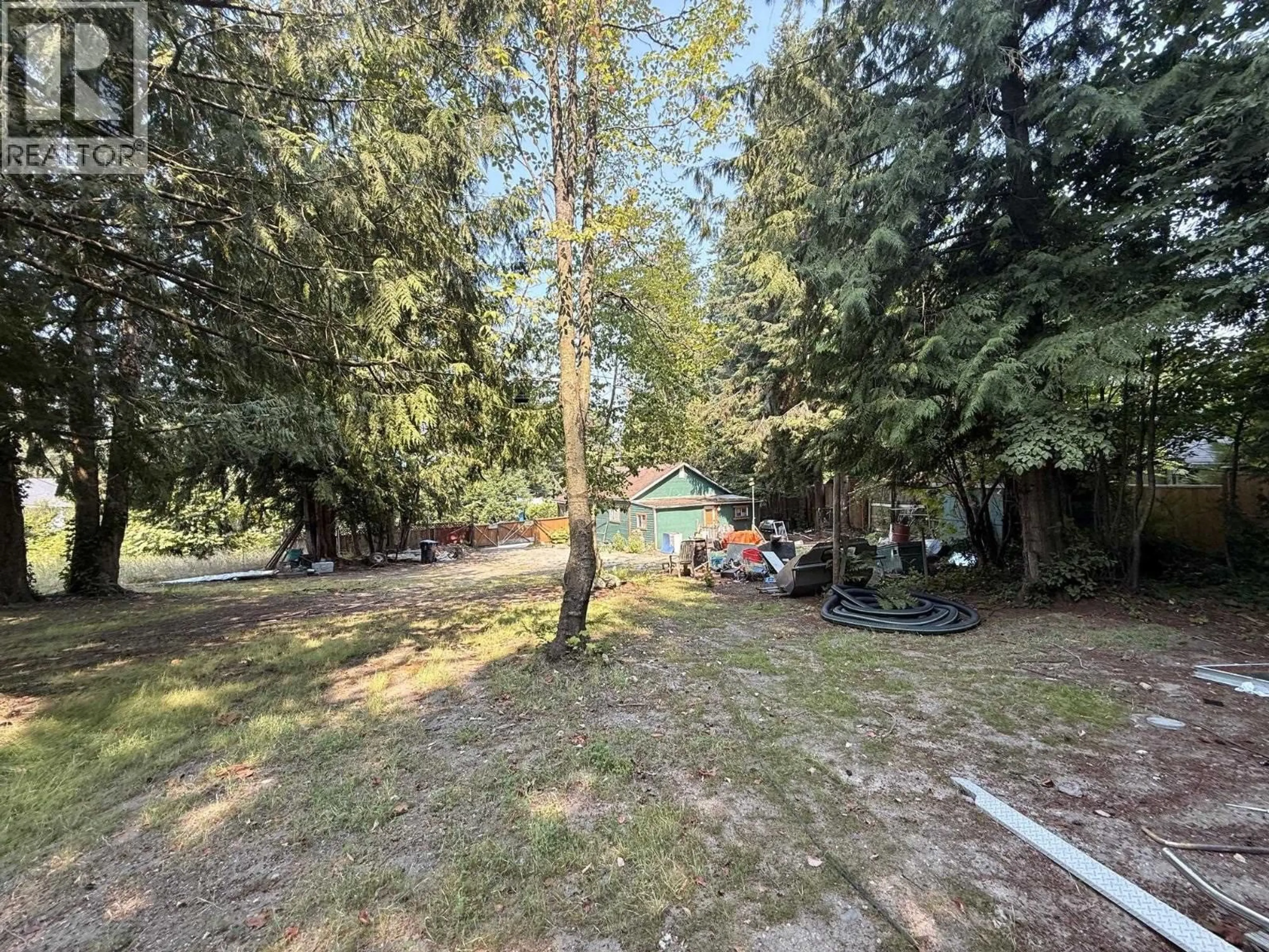 A pic from outside/outdoor area/front of a property/back of a property/a pic from drone, forest/trees view for 5700 PORPOISE BAY ROAD, Sechelt British Columbia V0N3A0