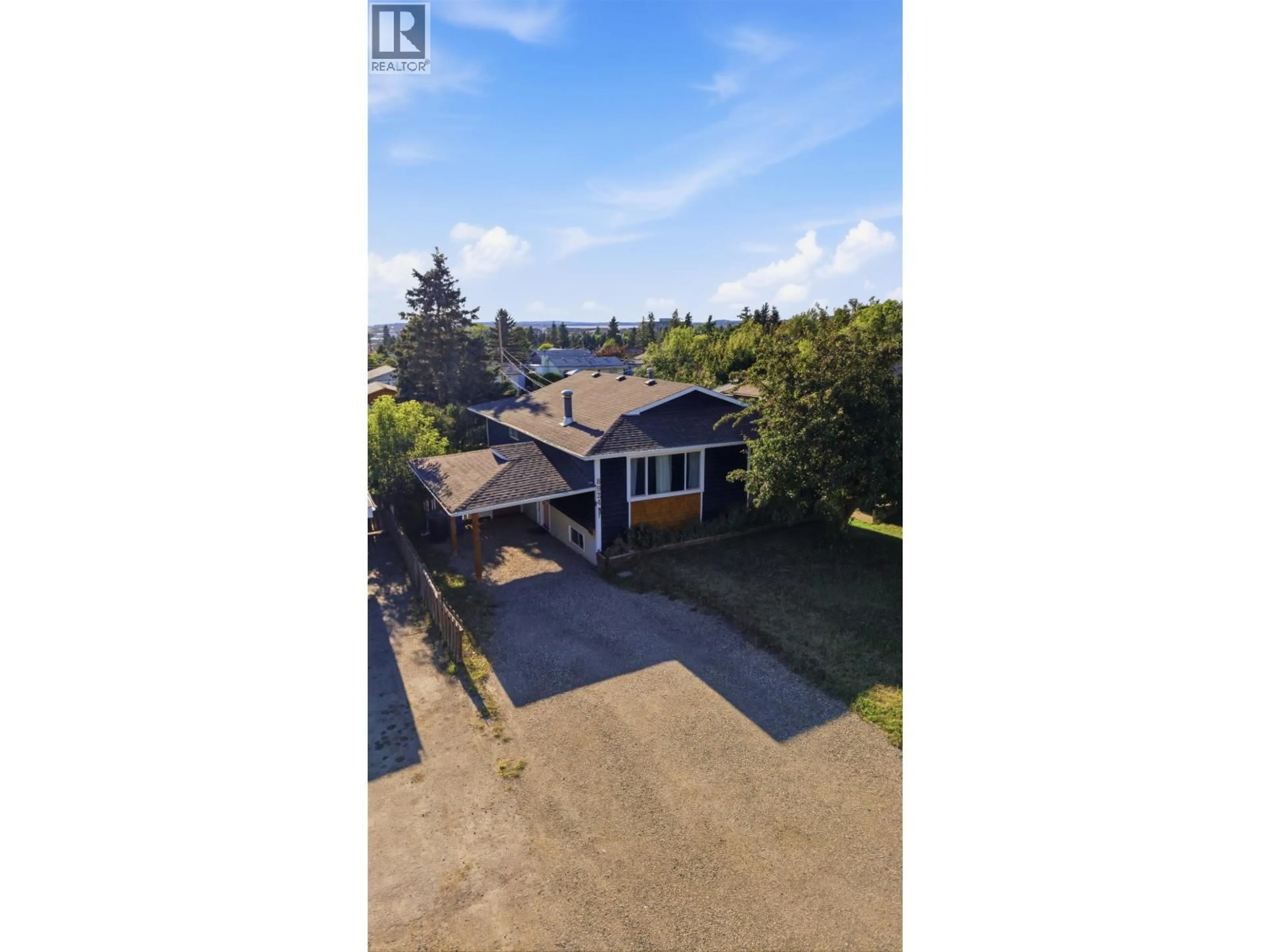 A pic from outside/outdoor area/front of a property/back of a property/a pic from drone, water/lake/river/ocean view for 8924 88 STREET, Fort St. John British Columbia V1J5B2