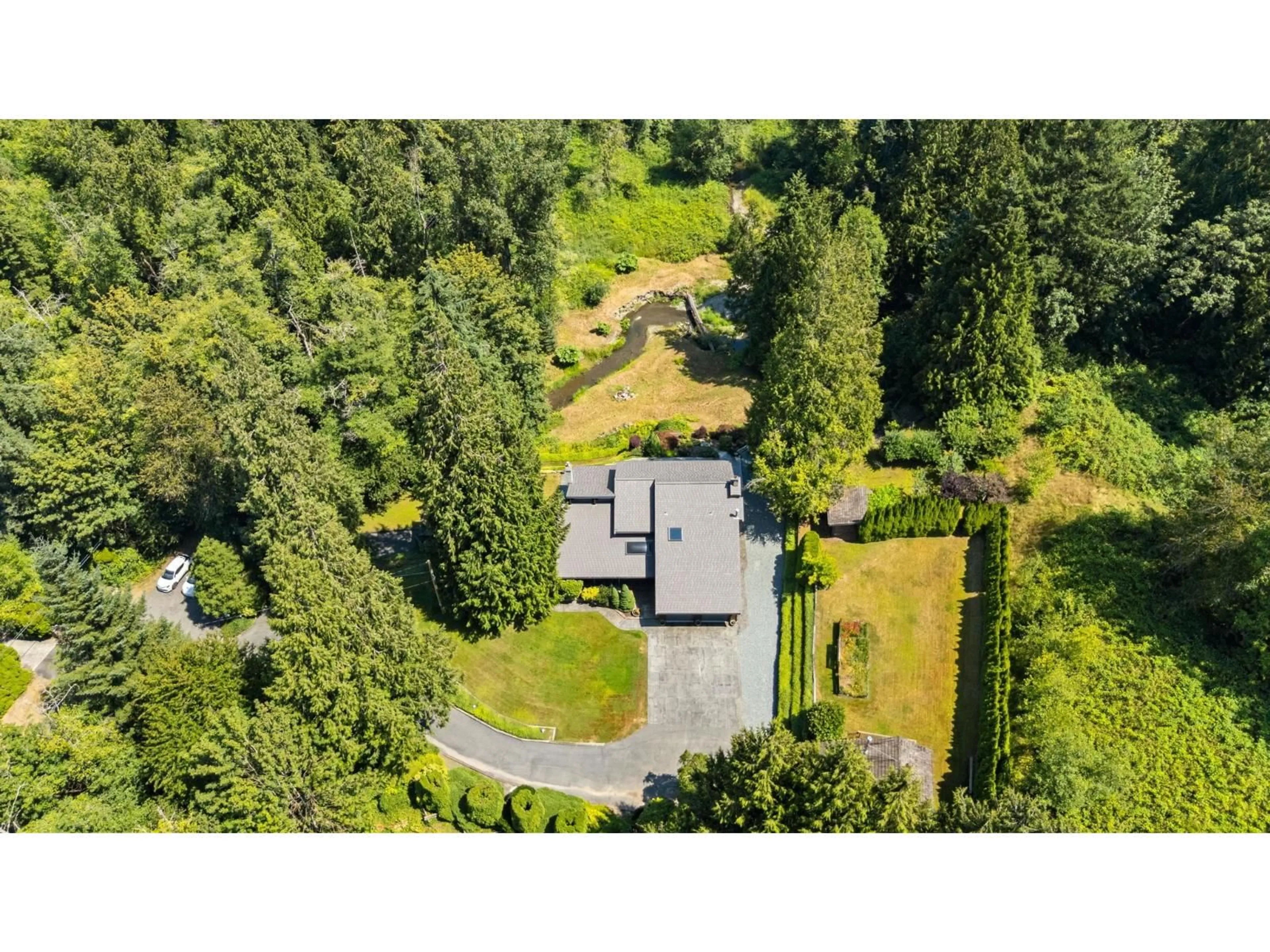 A pic from outside/outdoor area/front of a property/back of a property/a pic from drone, forest/trees view for 23956 64 AVENUE, Langley British Columbia V2Y2G8