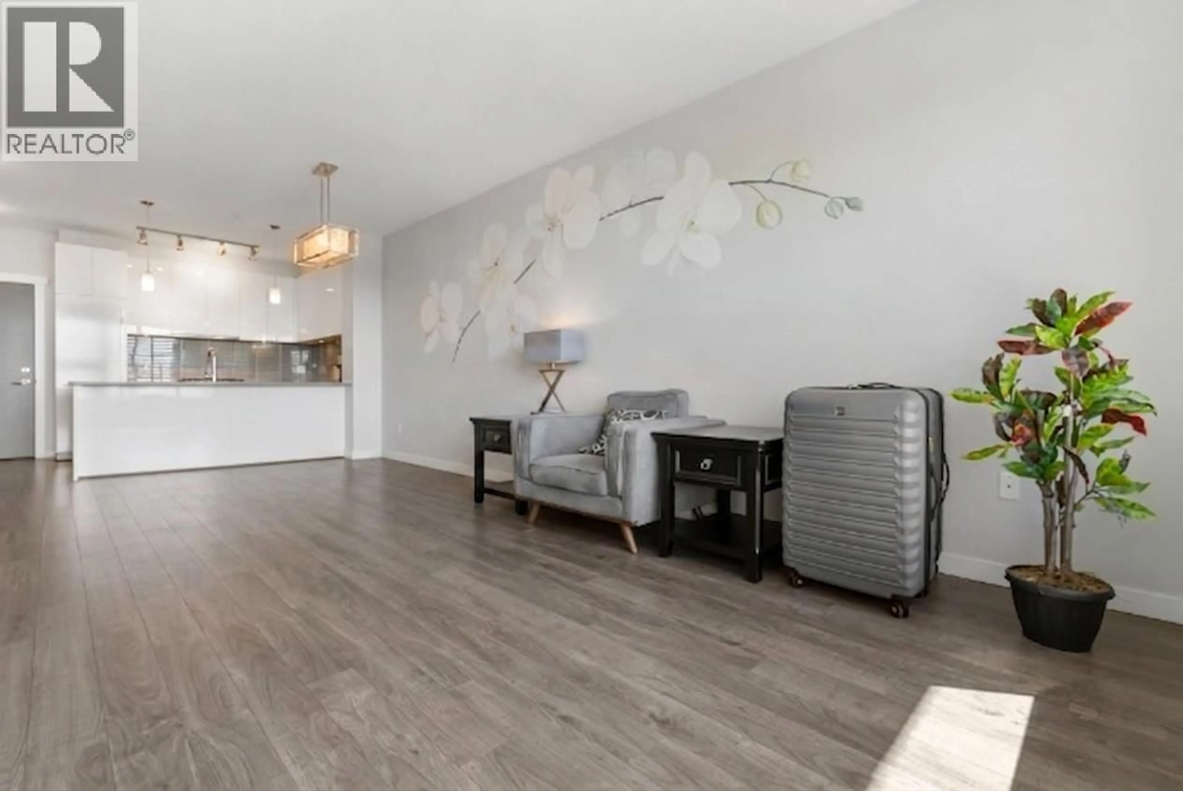 Living room with furniture, wood/laminate floor for 613 - 9311 ALEXANDRA ROAD, Richmond British Columbia V6X0L8