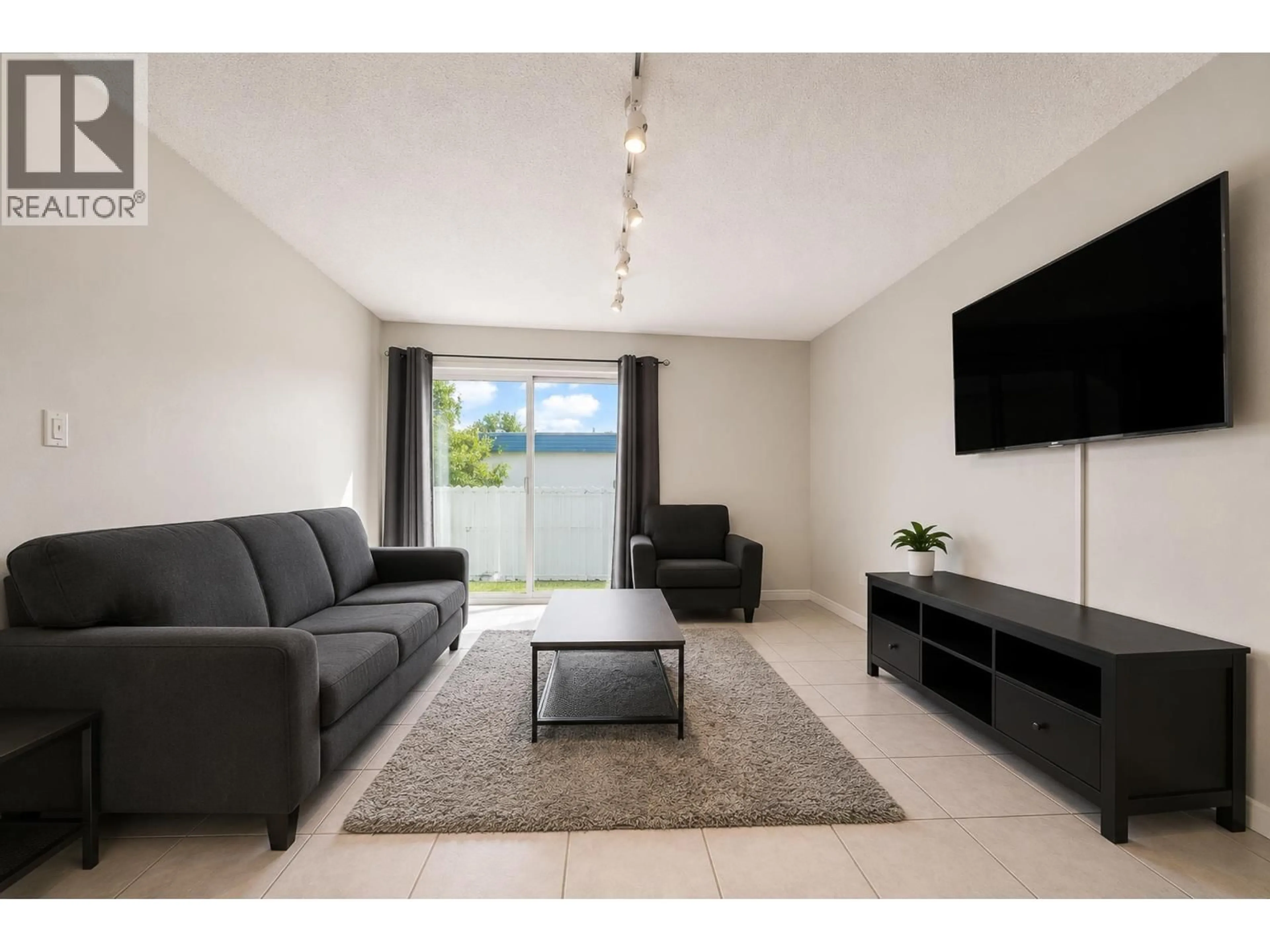 Living room with furniture, unknown for 306 - 7200 LINDSAY ROAD, Richmond British Columbia V6E1S8