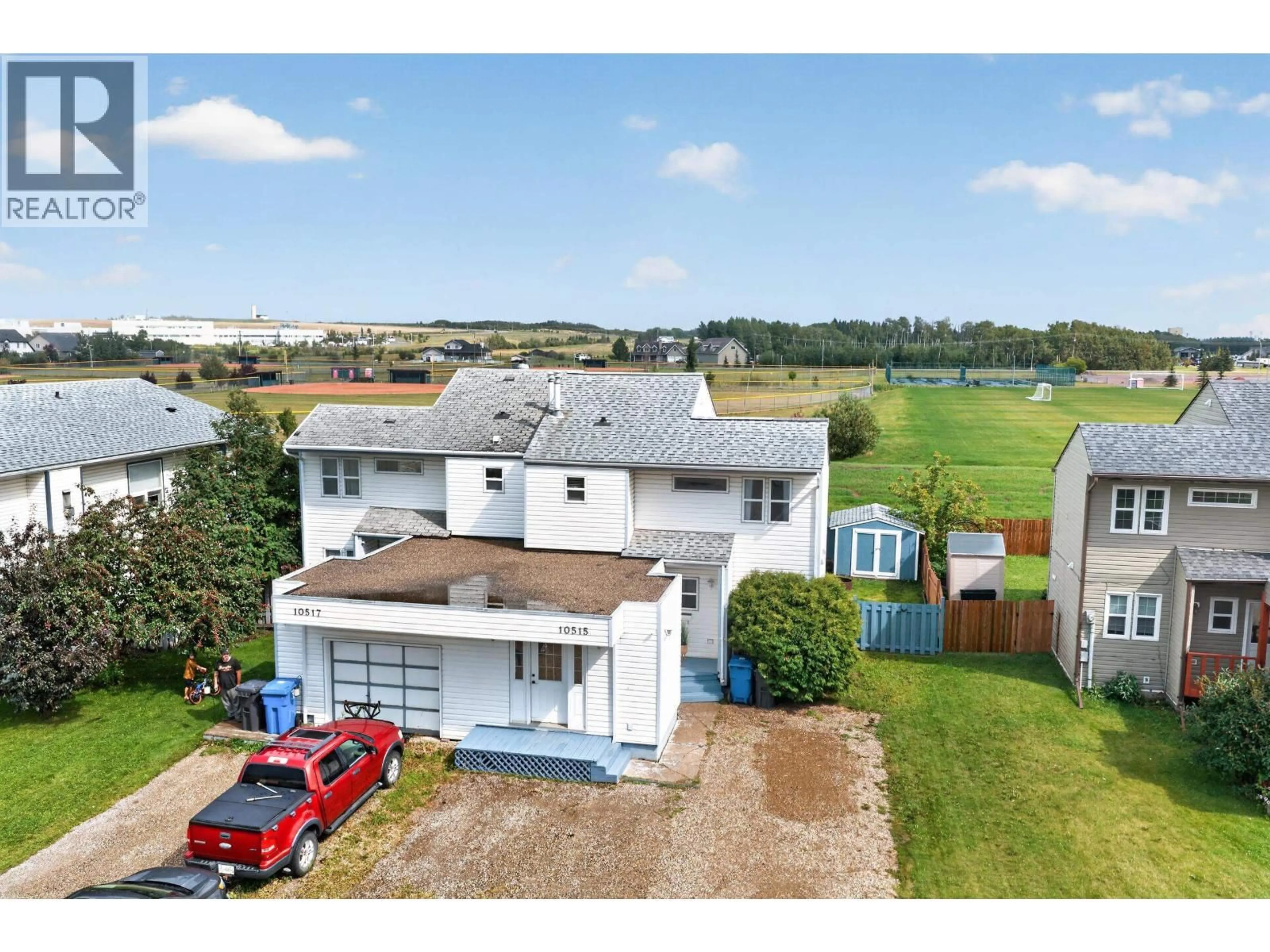 A pic from outside/outdoor area/front of a property/back of a property/a pic from drone, building for 10515 88A STREET, Fort St. John British Columbia V1J5X8