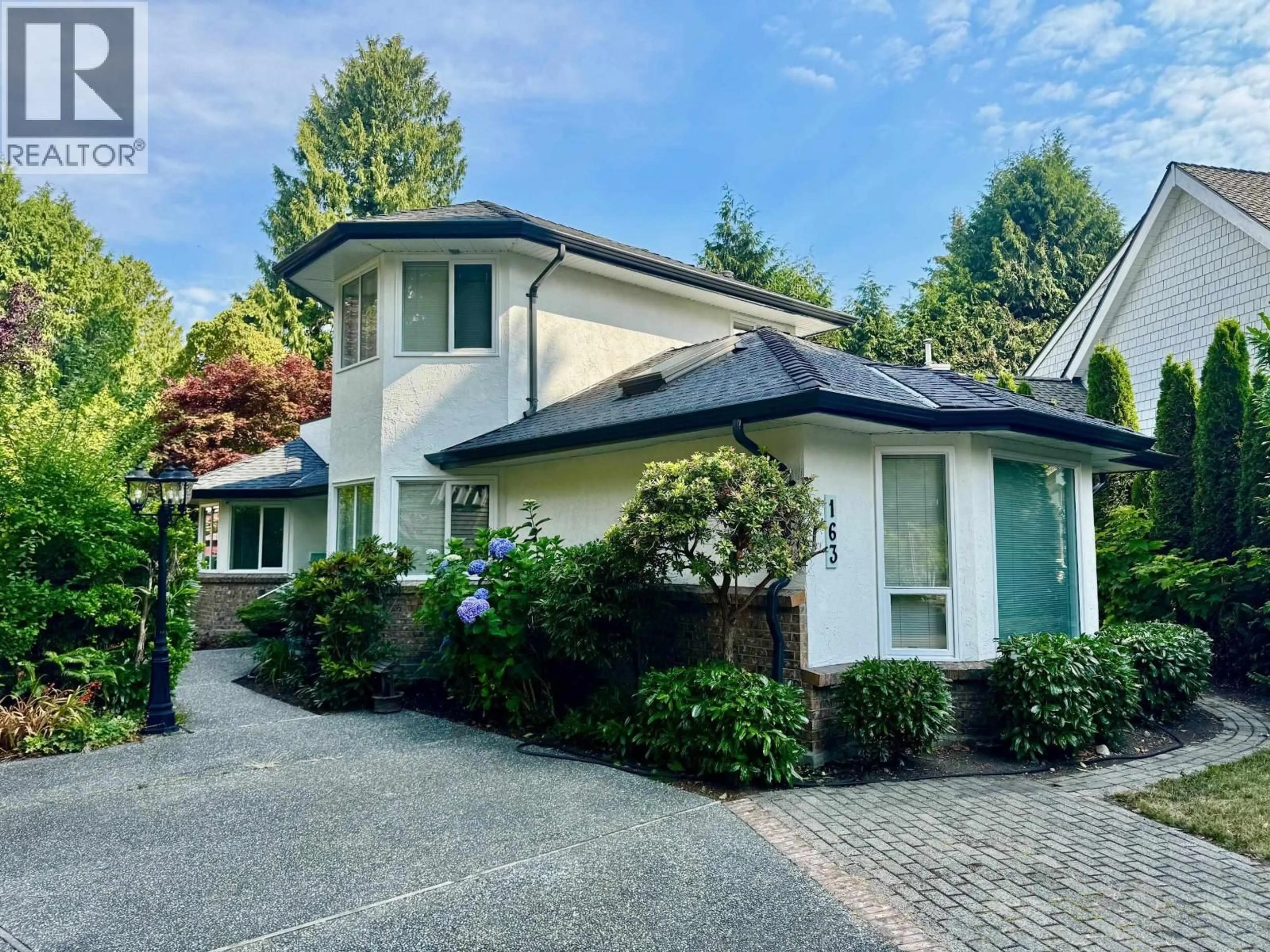 Home with vinyl exterior material, street for 163 49 STREET, Delta British Columbia V4M2P1