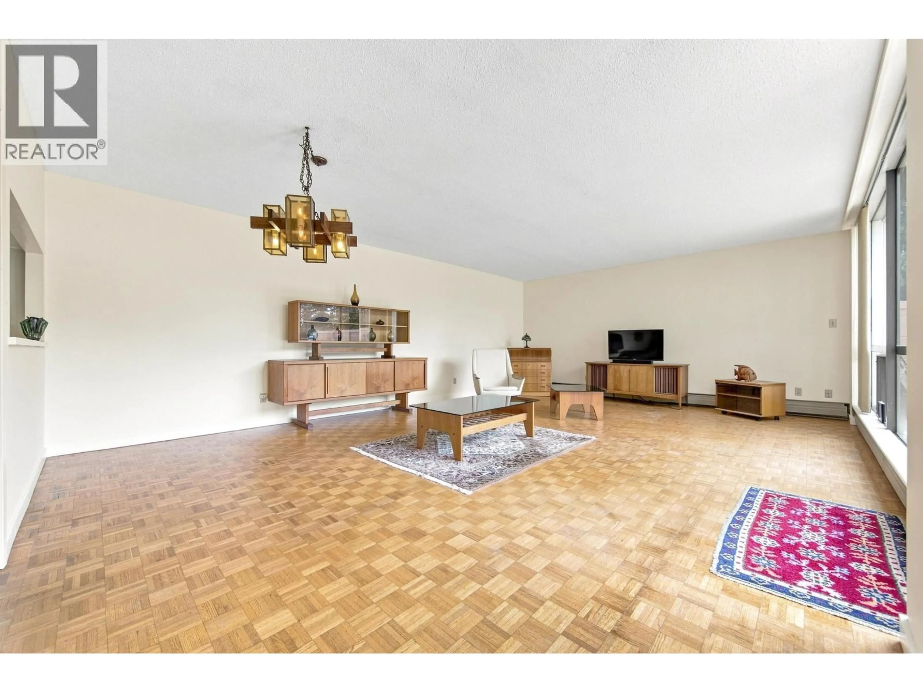 Living room with furniture, wood/laminate floor for 509 - 4900 CARTIER STREET, Vancouver British Columbia V6M4H2