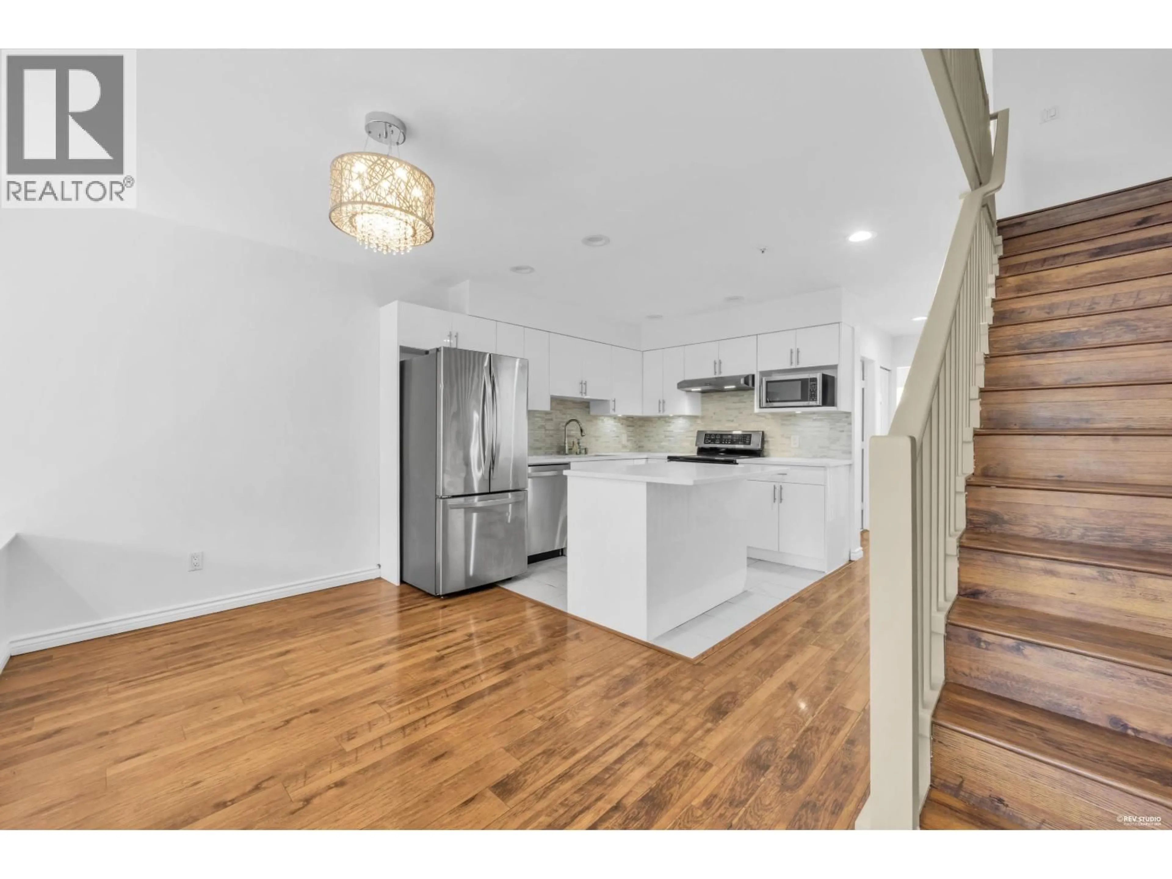 Open concept kitchen, wood/laminate floor for 3396 COBBLESTONE AVENUE, Vancouver British Columbia V5S4S4