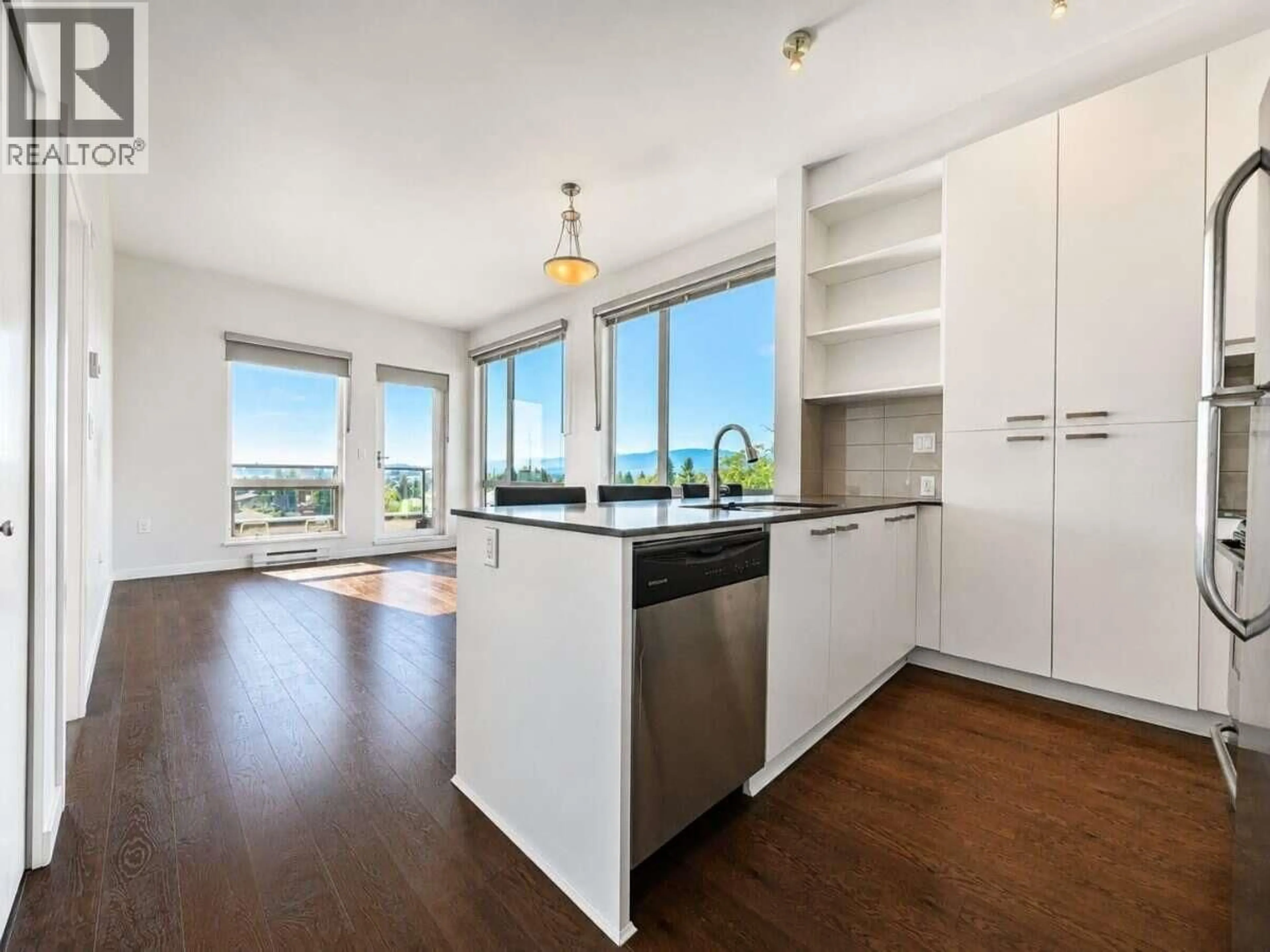 Open concept kitchen, wood/laminate floor for 403 - 20331 DEWDNEY TRUNK ROAD, Maple Ridge British Columbia V2X3C9