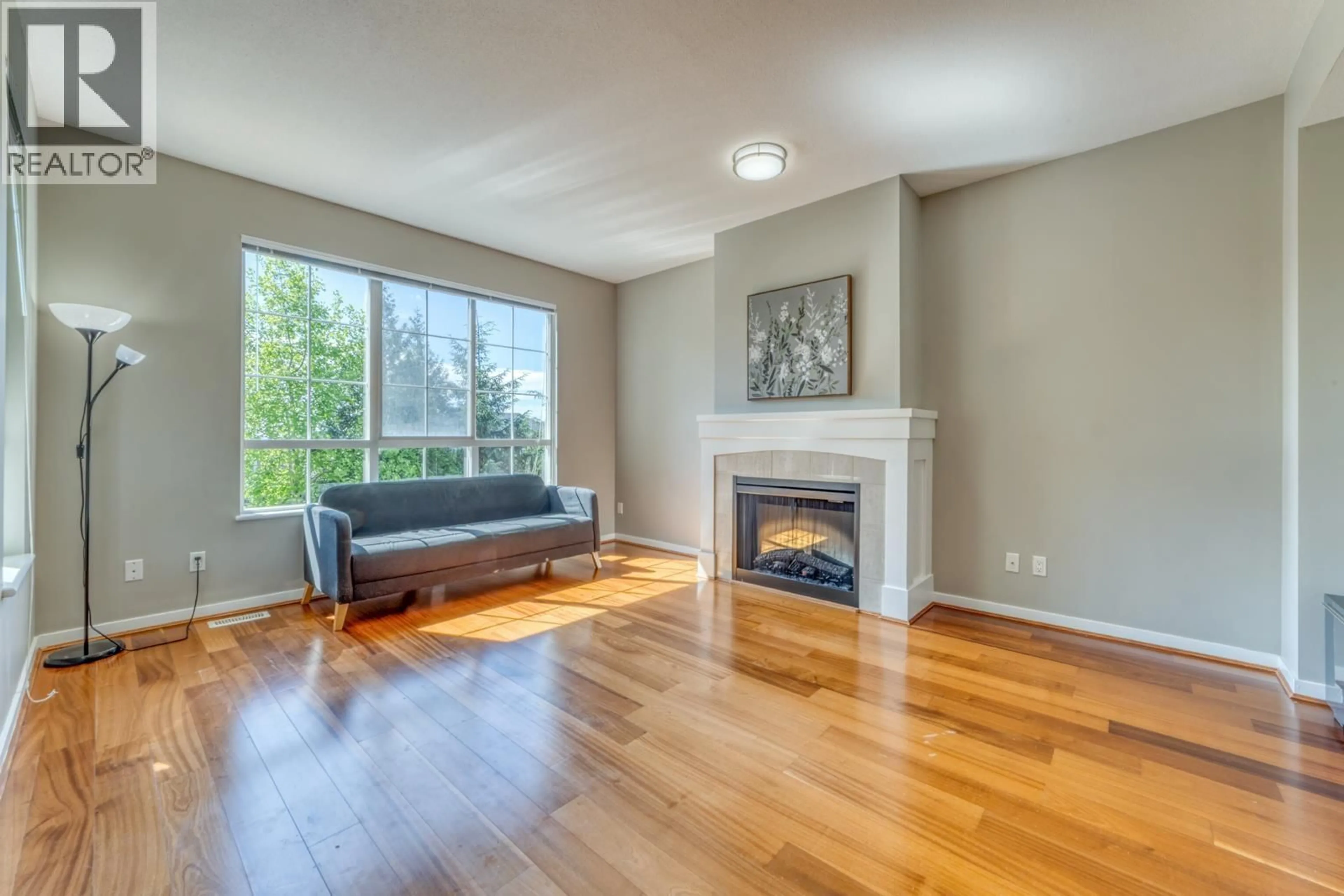 Living room with furniture, wood/laminate floor for 84 - 1380 PINETREE WAY, Coquitlam British Columbia V3E3S6