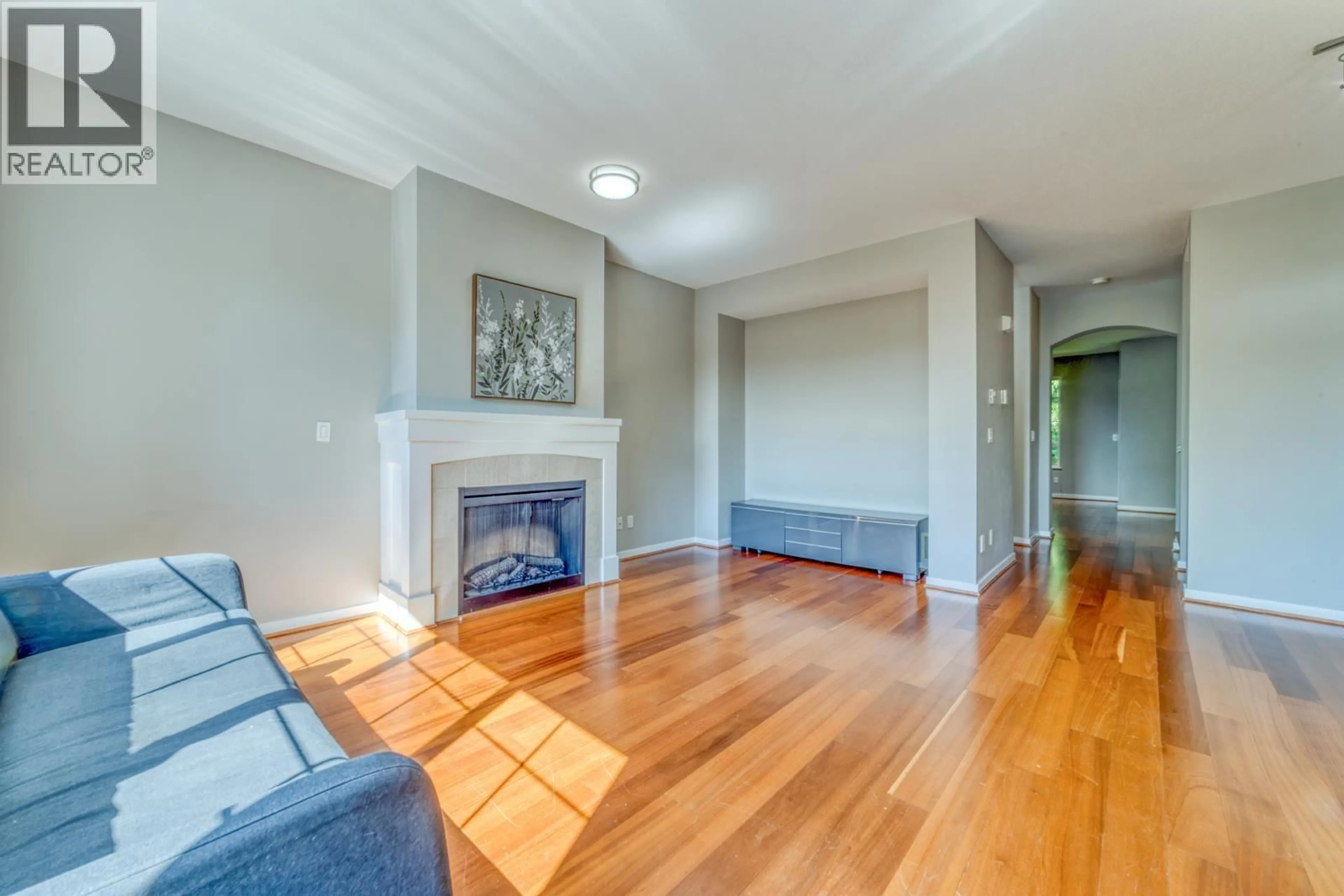 Living room with furniture, wood/laminate floor for 84 - 1380 PINETREE WAY, Coquitlam British Columbia V3E3S6