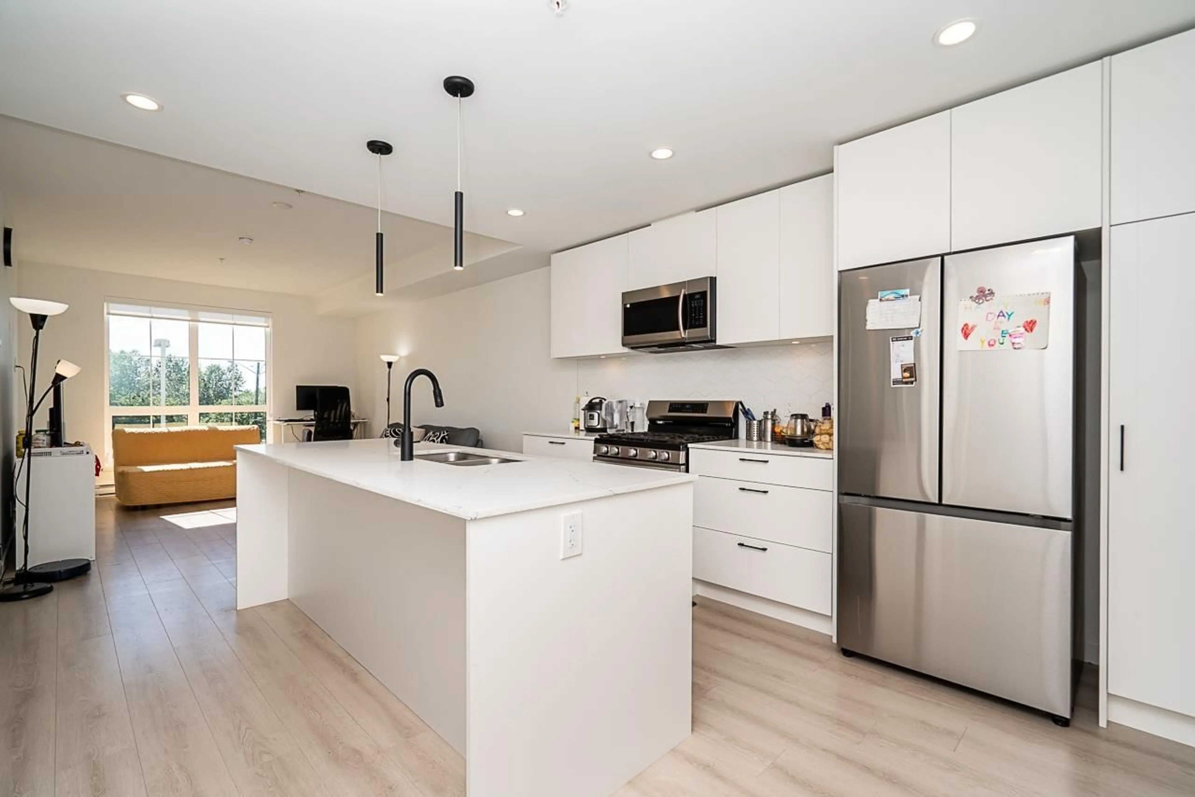 Open concept kitchen, wood/laminate floor for A210 - 20078 85 AVENUE, Langley British Columbia V2Y3Z3