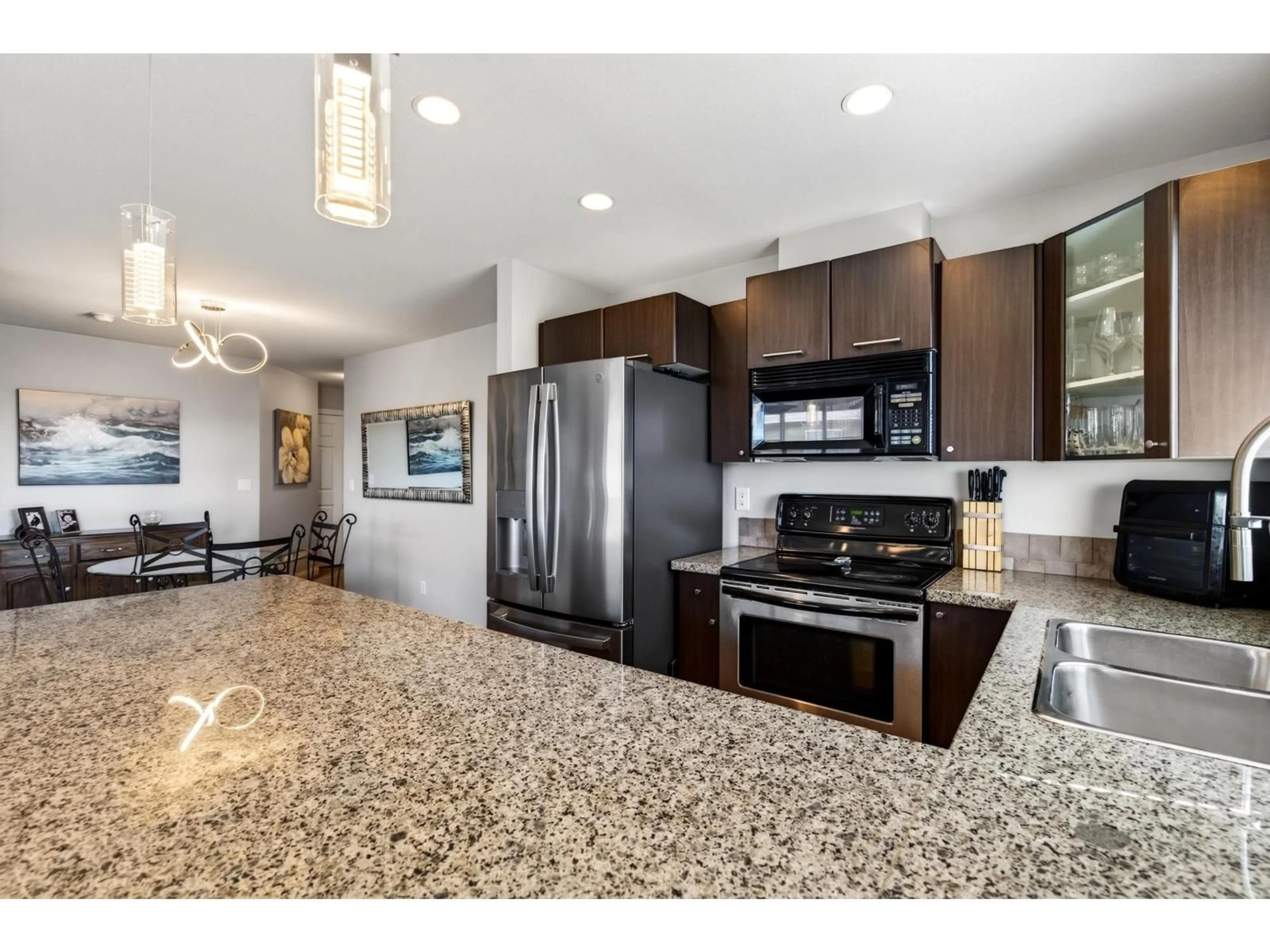 Open concept kitchen, ceramic/tile floor for 412 - 5488 198 STREET, Langley British Columbia V3A1G2