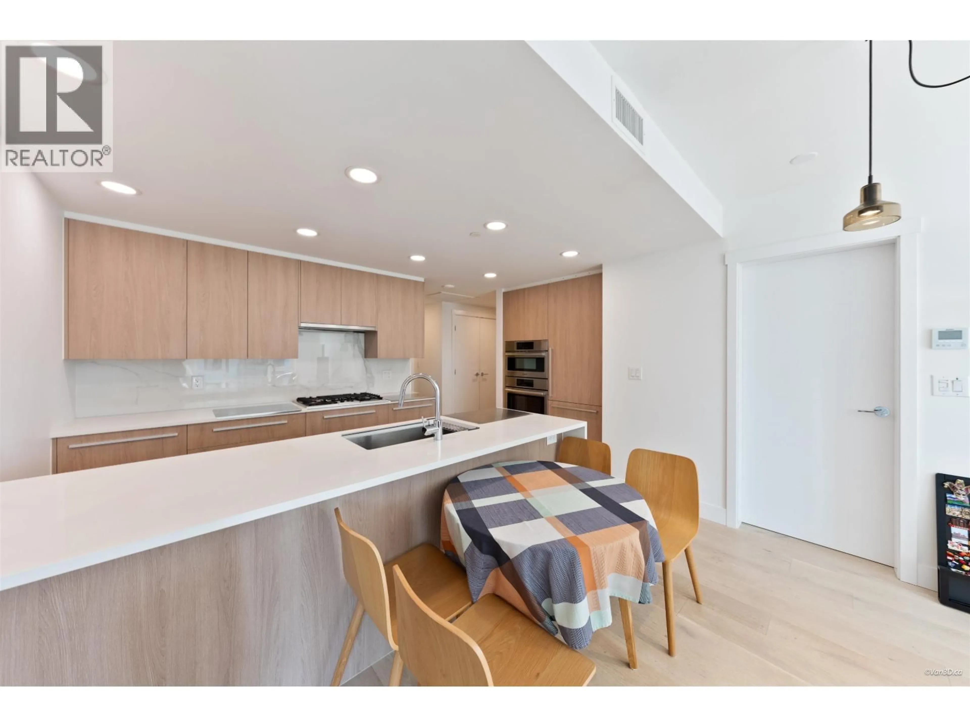 Open concept kitchen, unknown for 504 - 2780 VALLEY CENTRE AVENUE, North Vancouver British Columbia V7J0C4