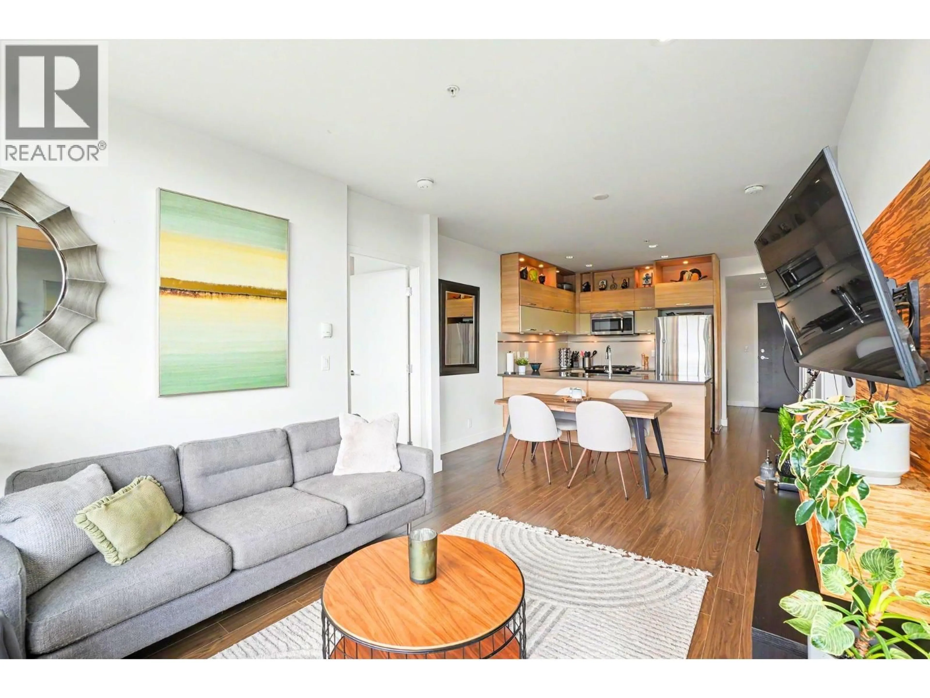 Living room with furniture, wood/laminate floor for 9150 UNIVERSITY HIGH STREET, Burnaby British Columbia V5A0C5