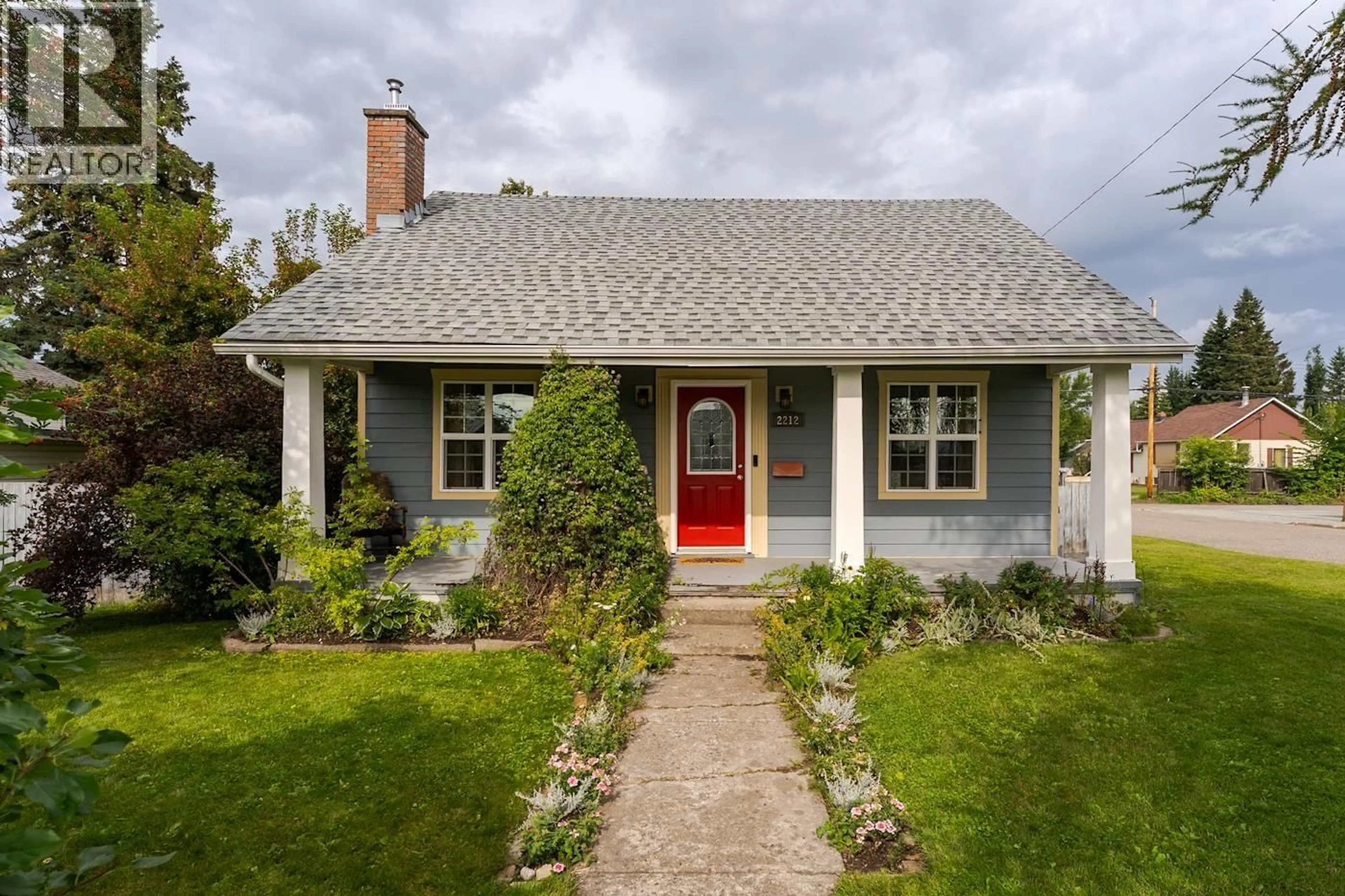 Home with vinyl exterior material, street for 2212 MCBRIDE CRESCENT, Prince George British Columbia V2M1Z7