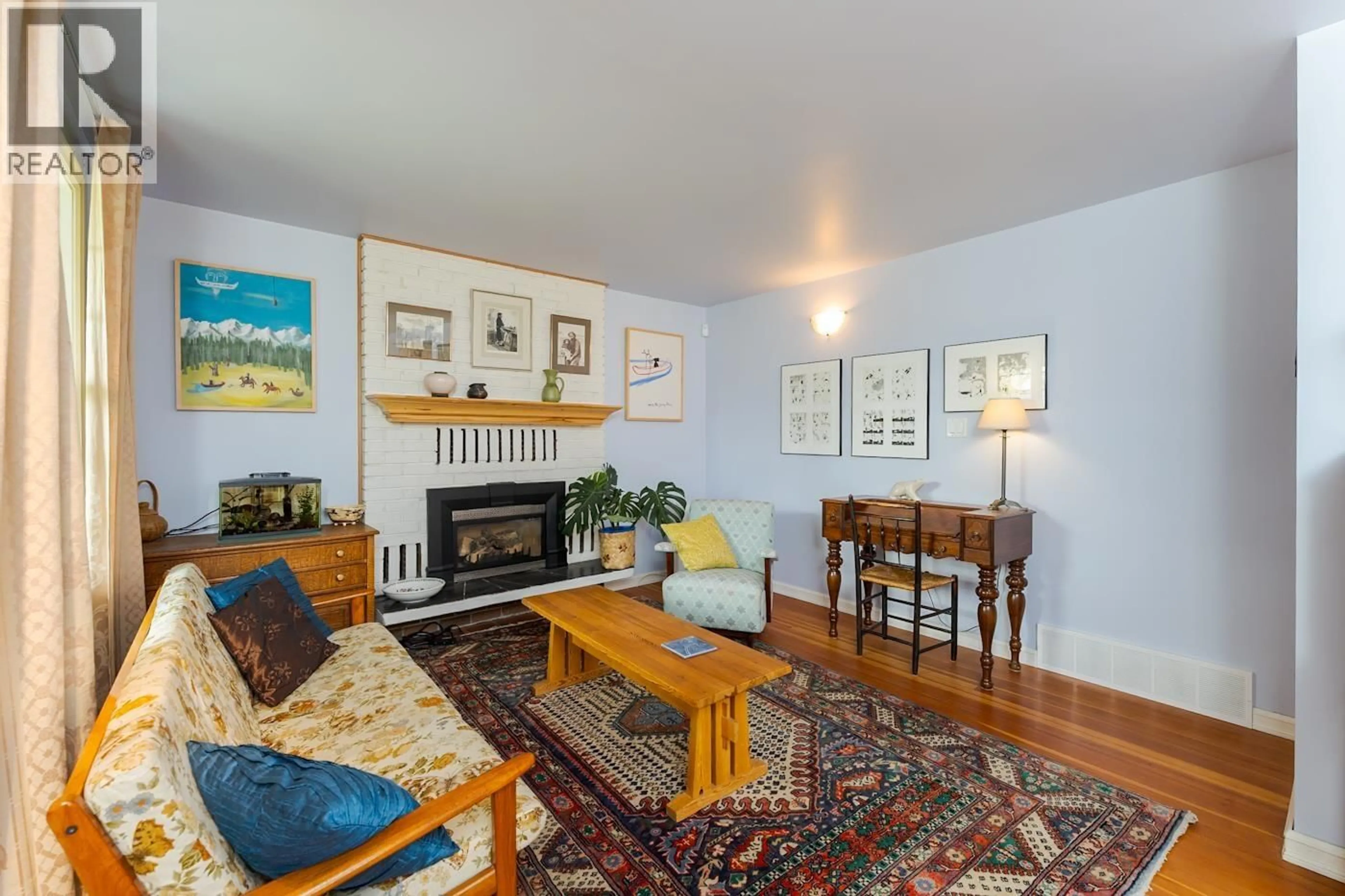 Living room with furniture, wood/laminate floor for 2212 MCBRIDE CRESCENT, Prince George British Columbia V2M1Z7