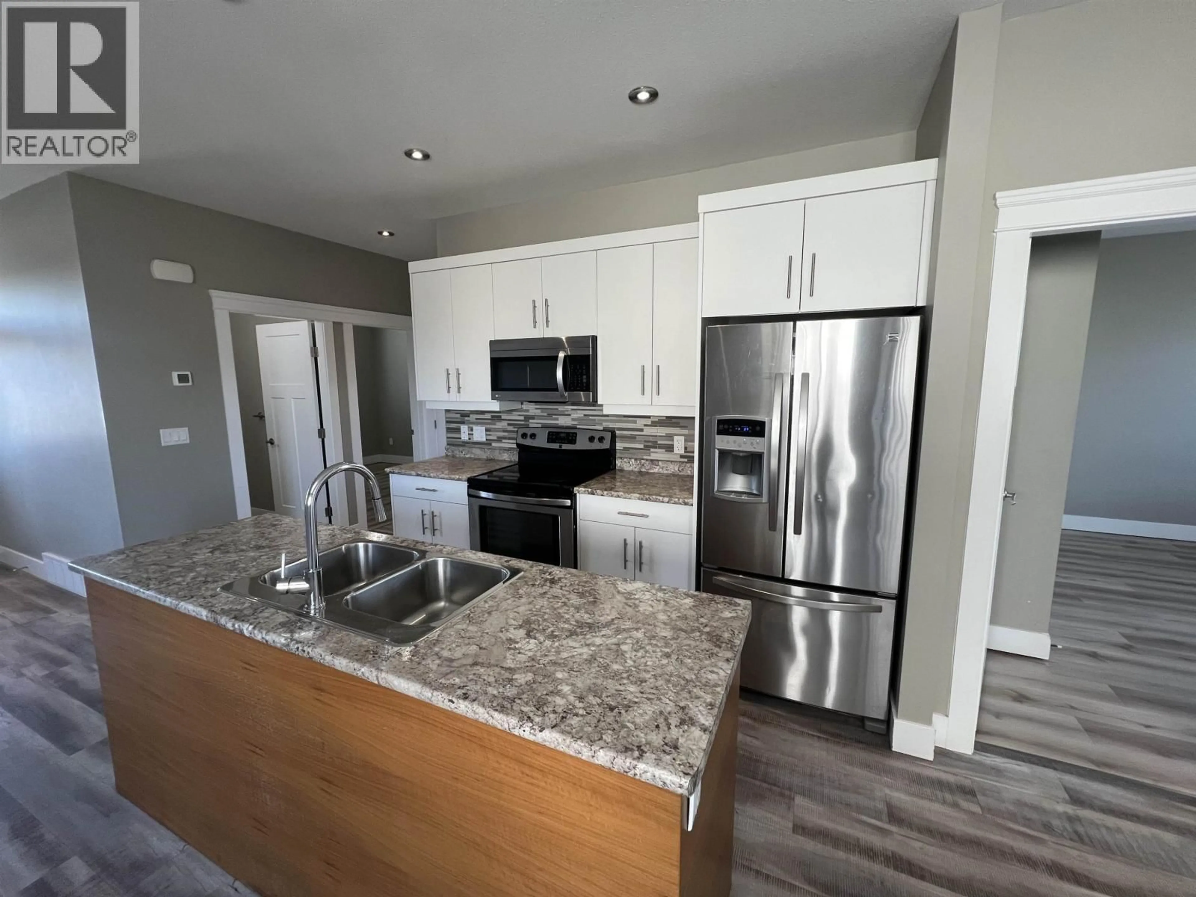 Open concept kitchen, unknown for 8215 88 AVENUE, Fort St. John British Columbia V1J0N9