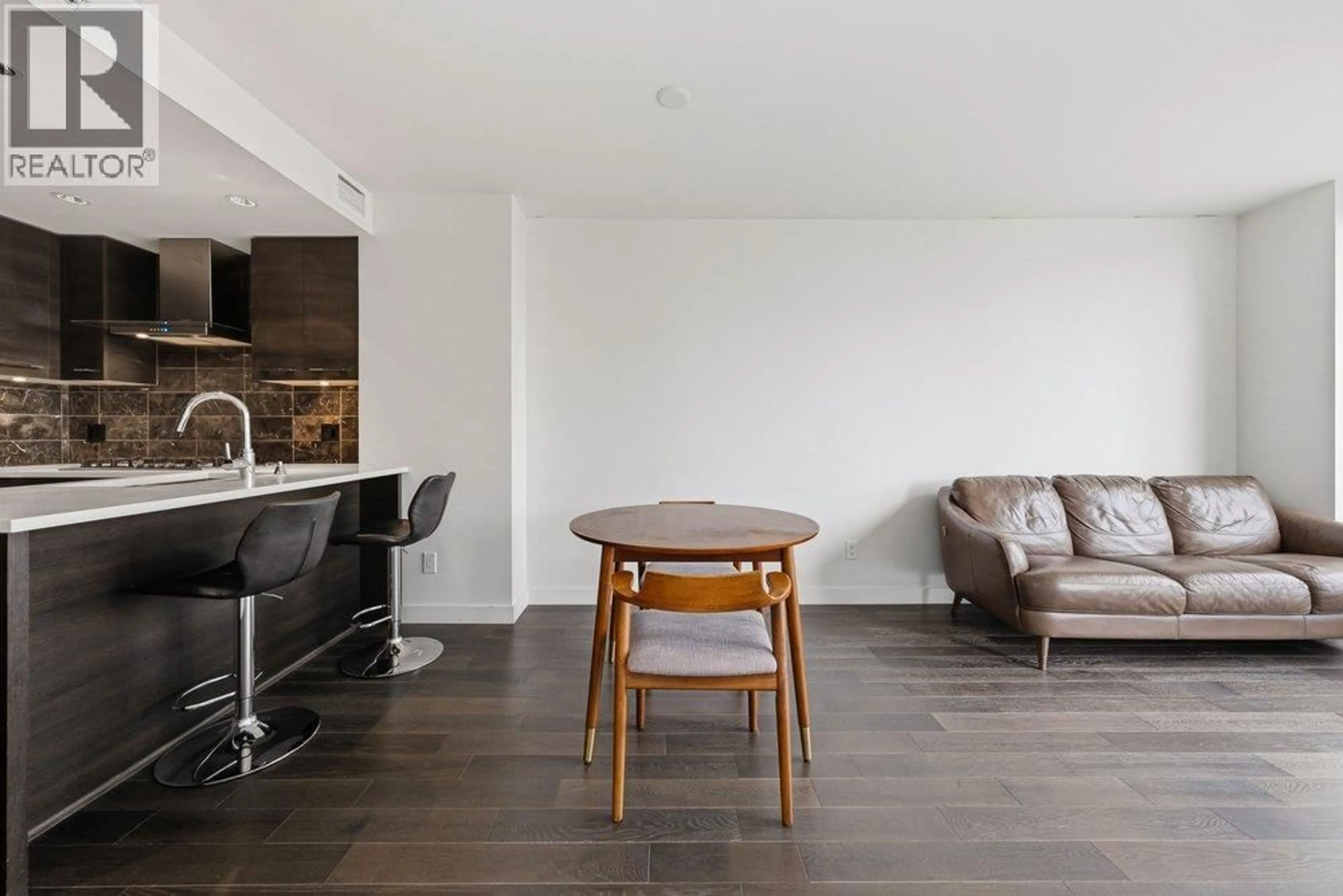 Living room with furniture, wood/laminate floor for 611 - 7488 LANSDOWNE ROAD, Richmond British Columbia V7C0B9