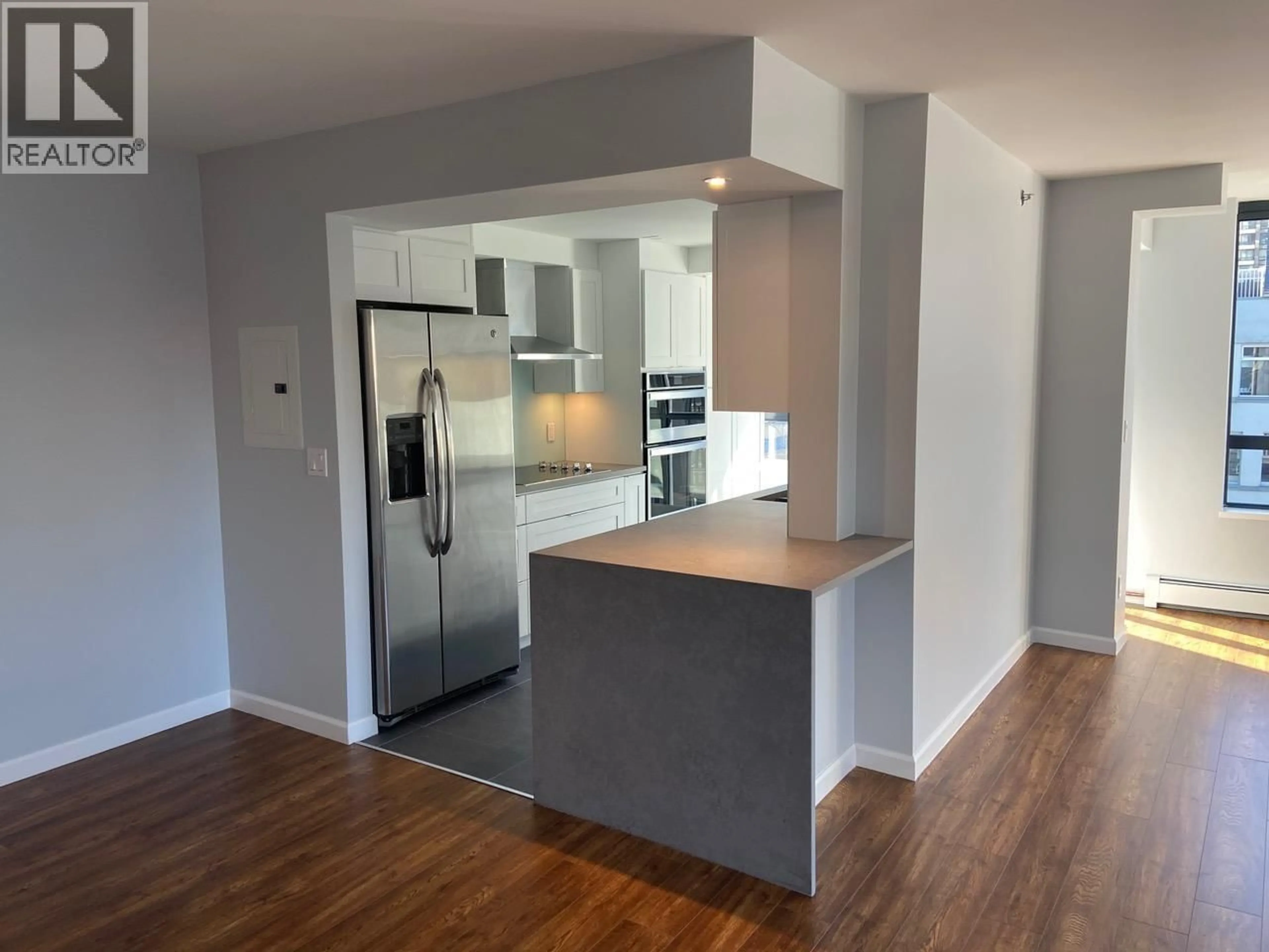 Open concept kitchen, wood/laminate floor for 701 - 289 DRAKE STREET, Vancouver British Columbia V6B5Z6