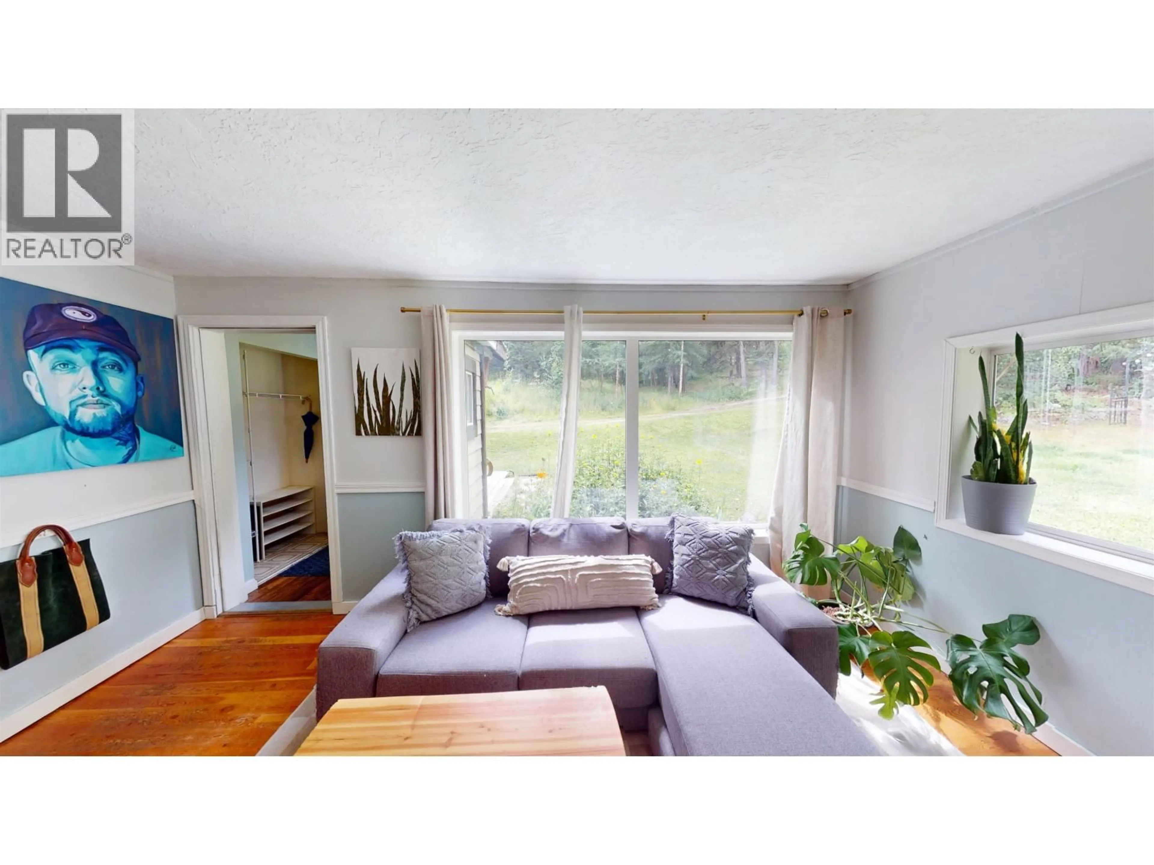 Living room with furniture, wood/laminate floor for 1154 MARSH ROAD, Quesnel British Columbia V2J6H3