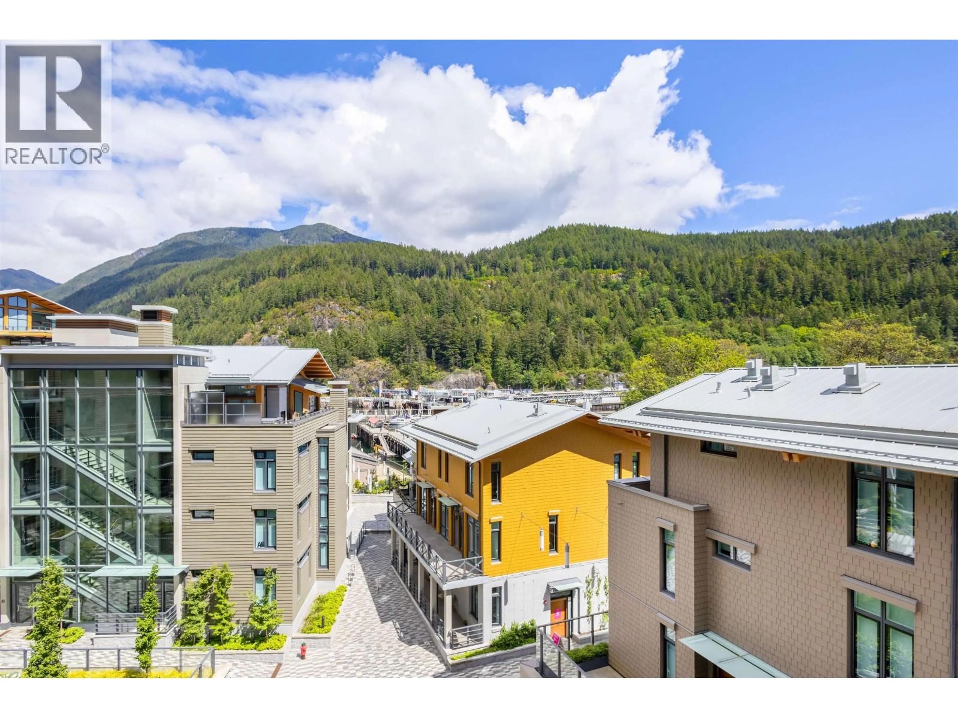 A pic from outside/outdoor area/front of a property/back of a property/a pic from drone, mountain view for 408 - 6687 NELSON AVENUE, West Vancouver British Columbia V7W2B2